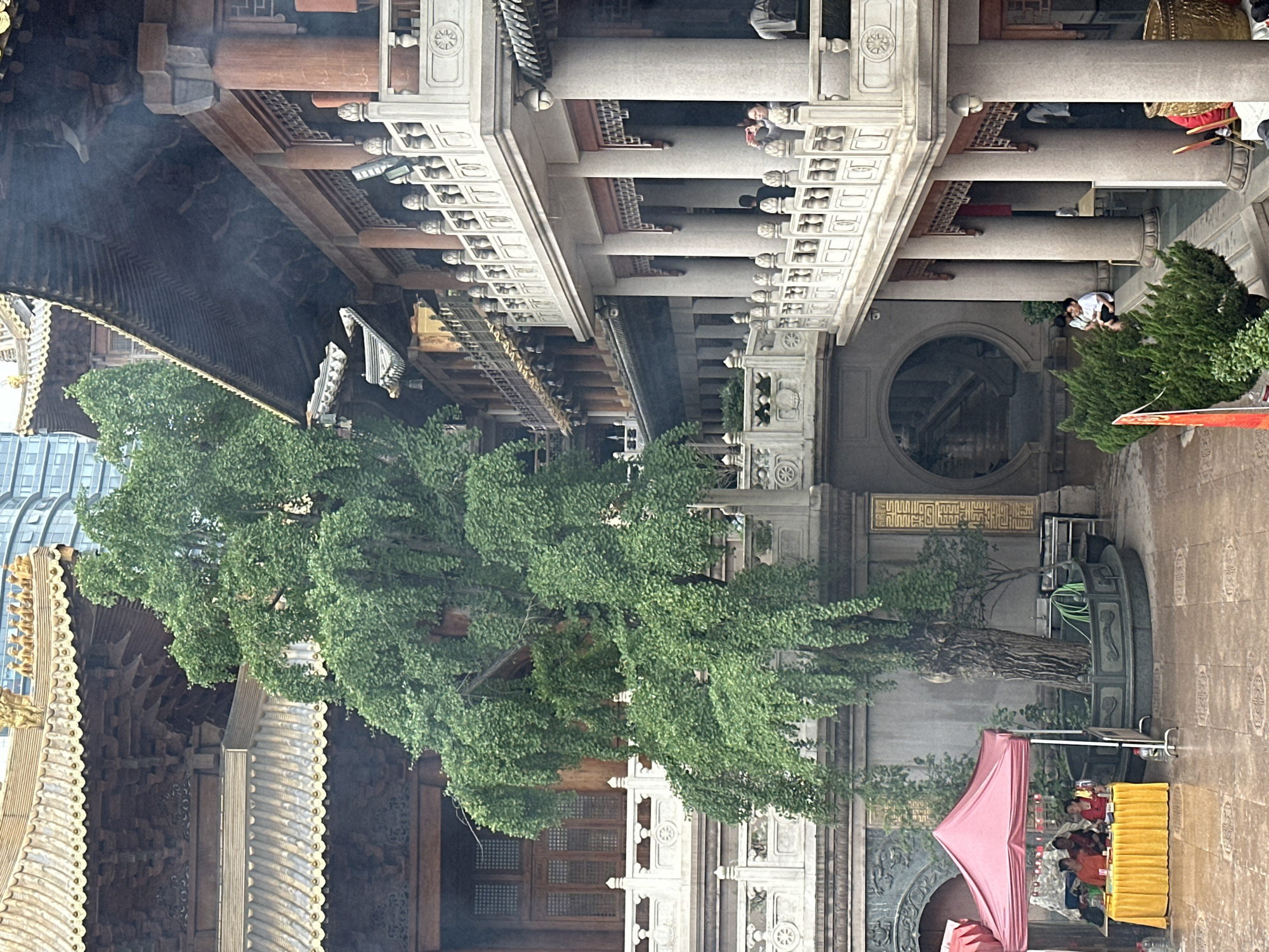 Inside and outside Jing'an Temple on a busy morning