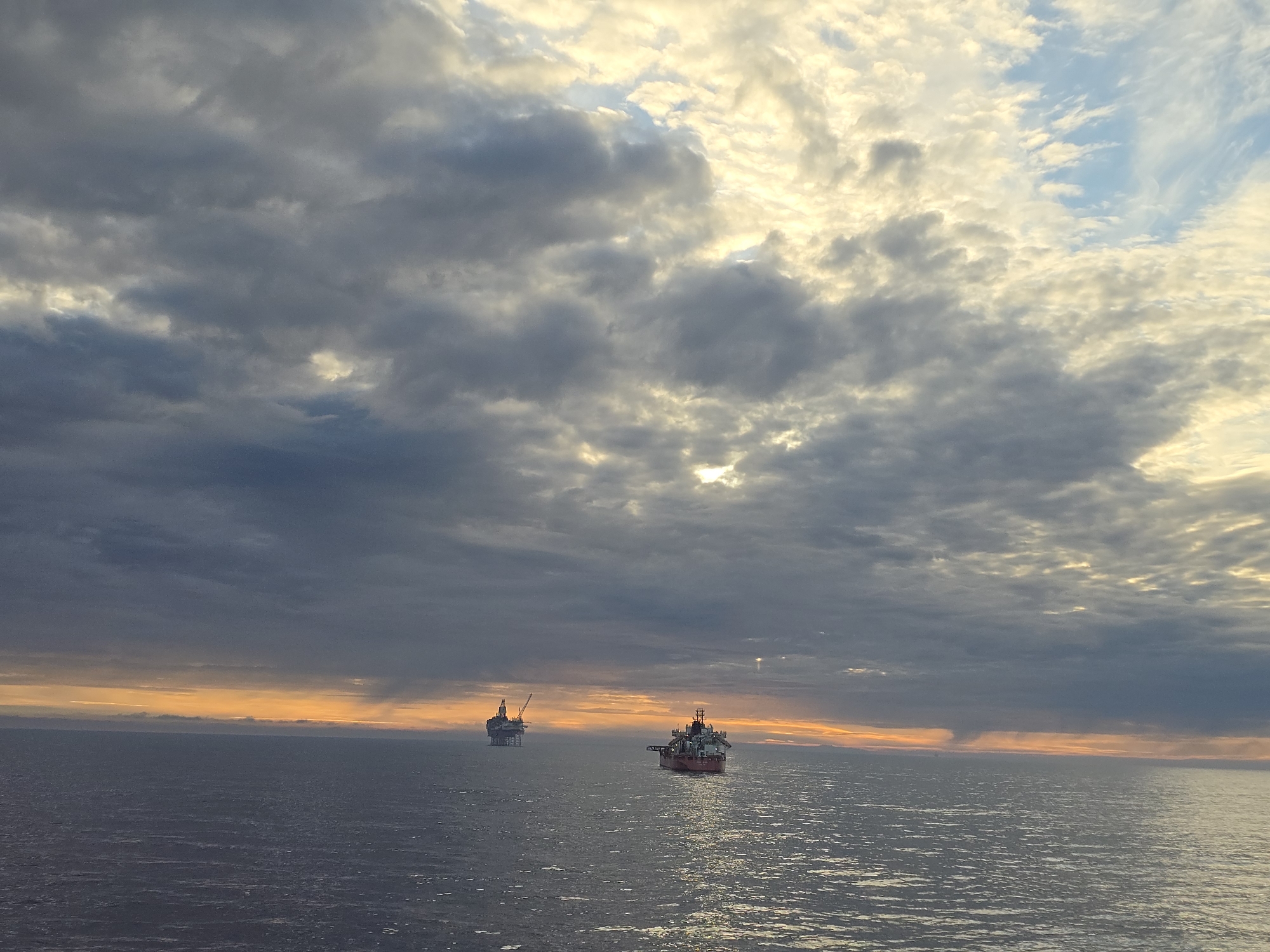 North Sea oil operations documented during dramatic sunset
