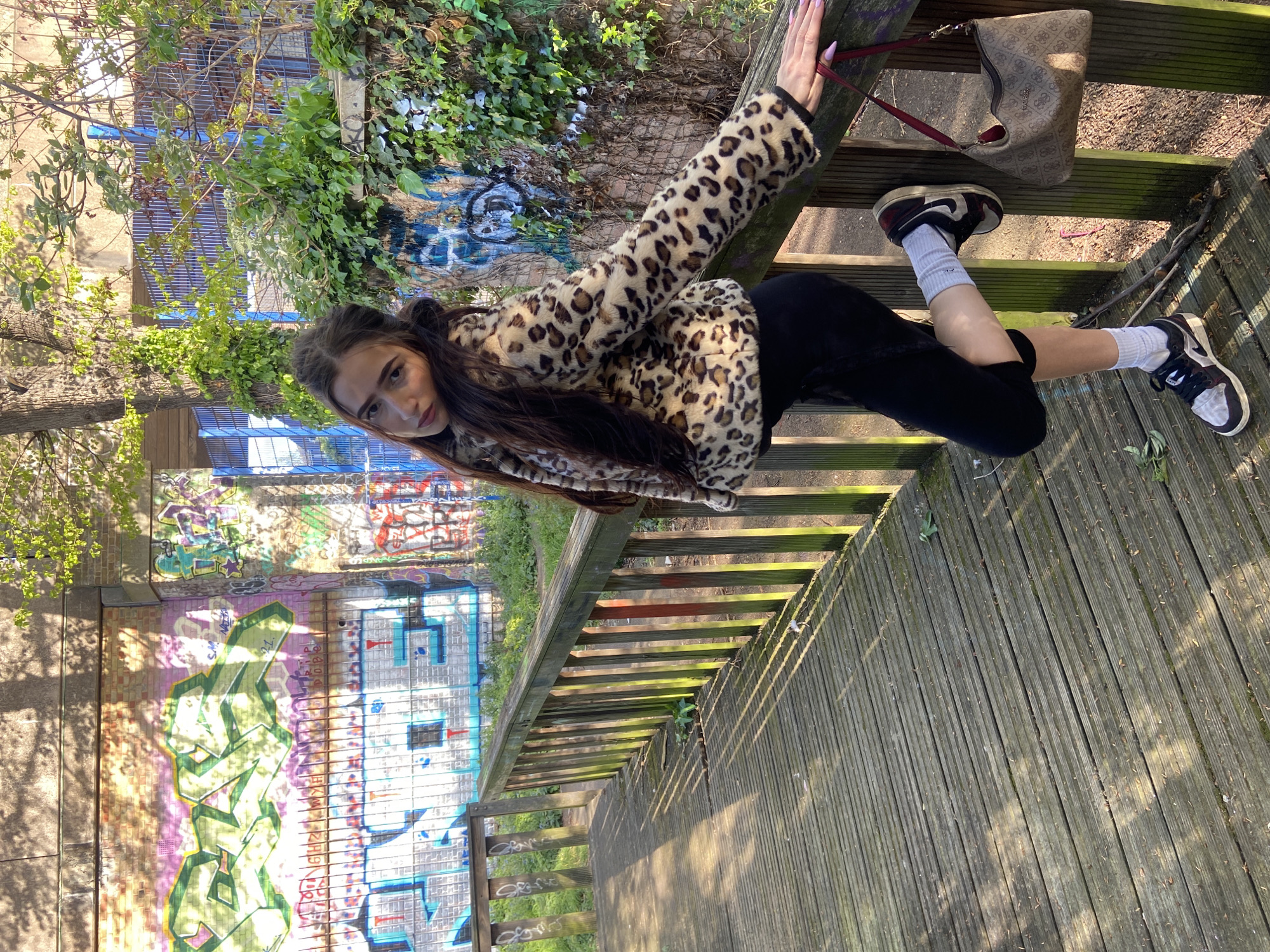 Woman poses for photos on London walkway