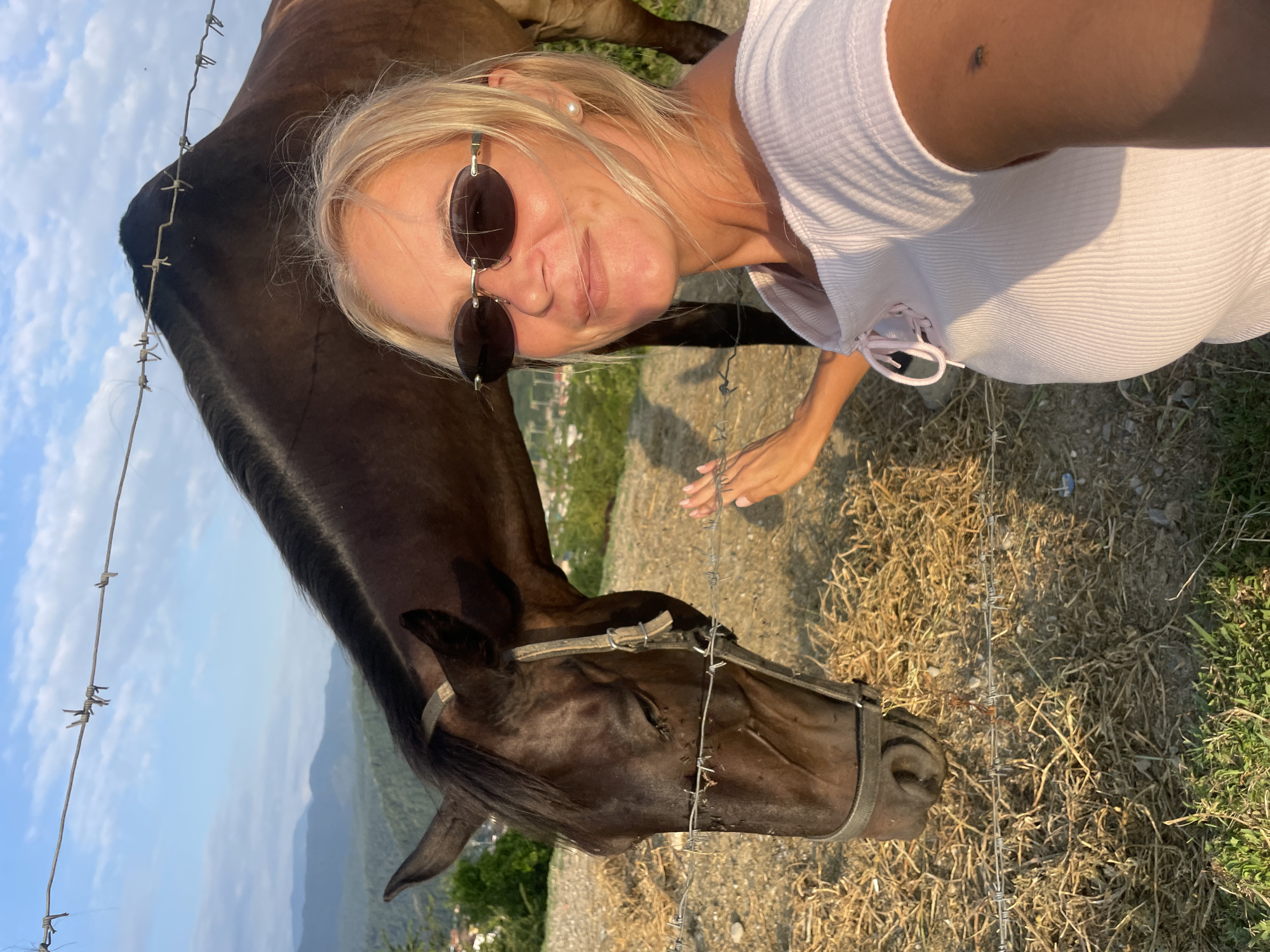 Selfies with a brown horse in rural Russia