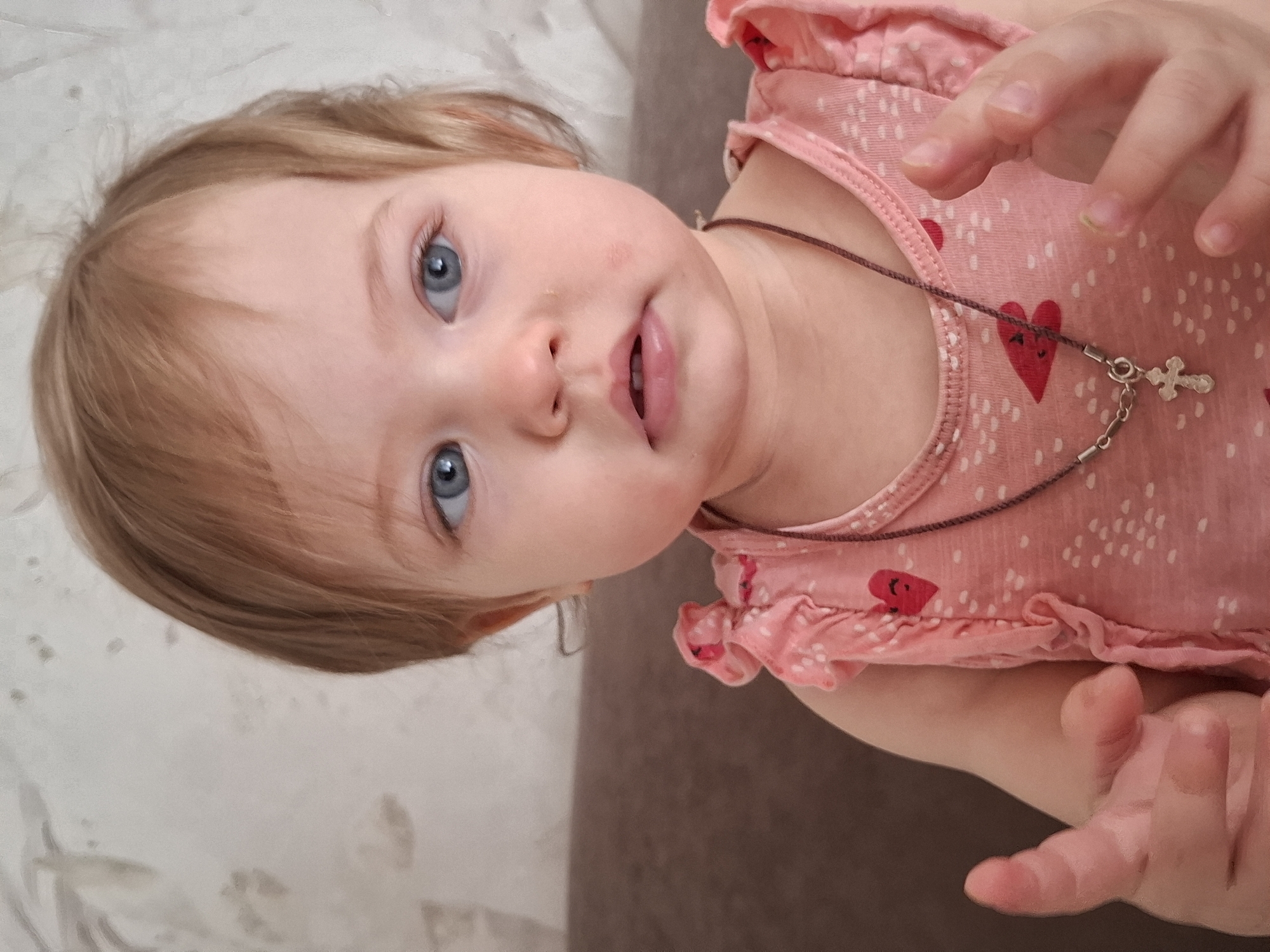 Toddler and cat captured in domestic portraits in Chaikovsky