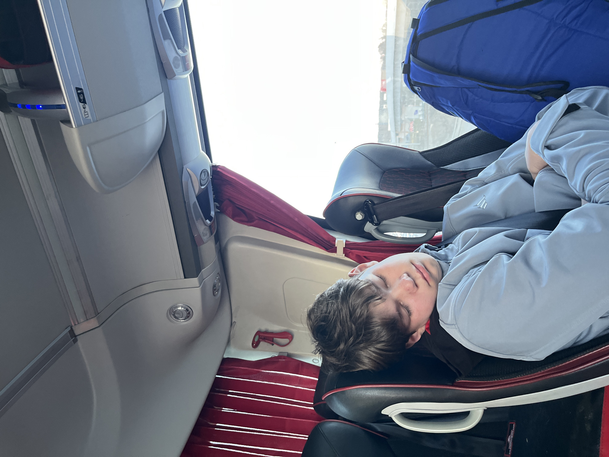 Young passenger sleeps on bus in Odintsovo, Russia