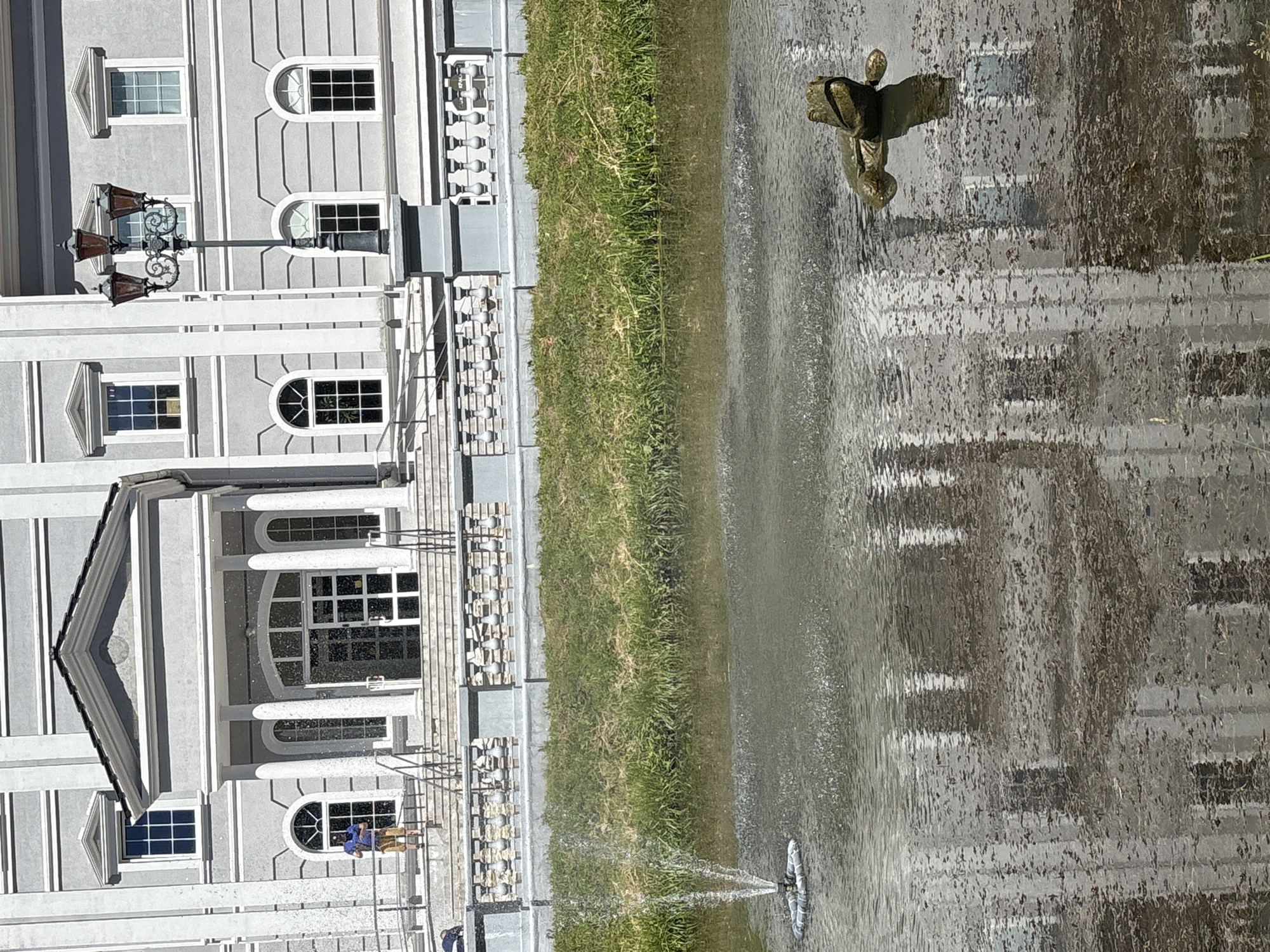 Classical building with pond and bronze frog, Kaliningrad