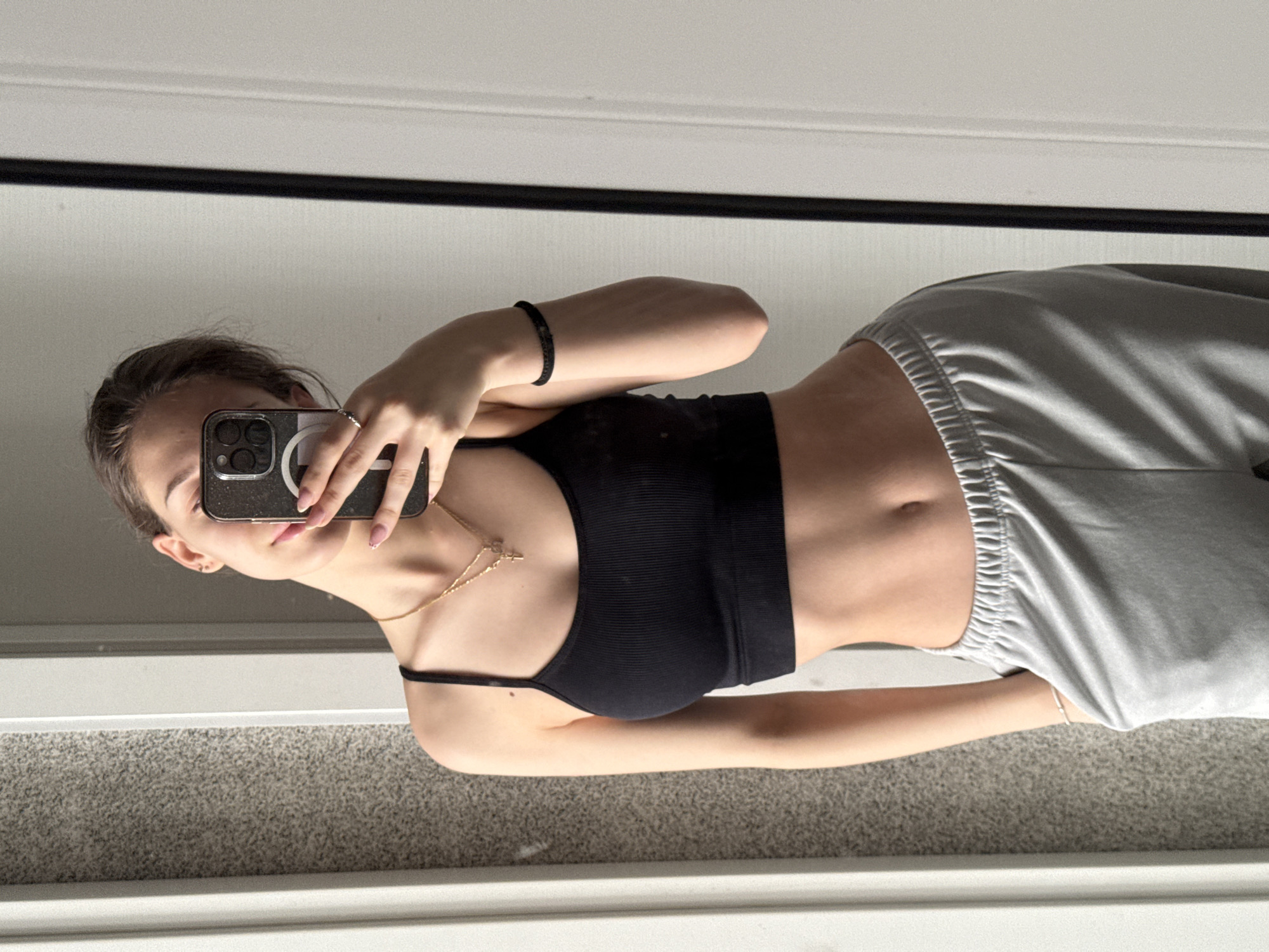 Woman takes morning mirror selfies in Sofia apartment