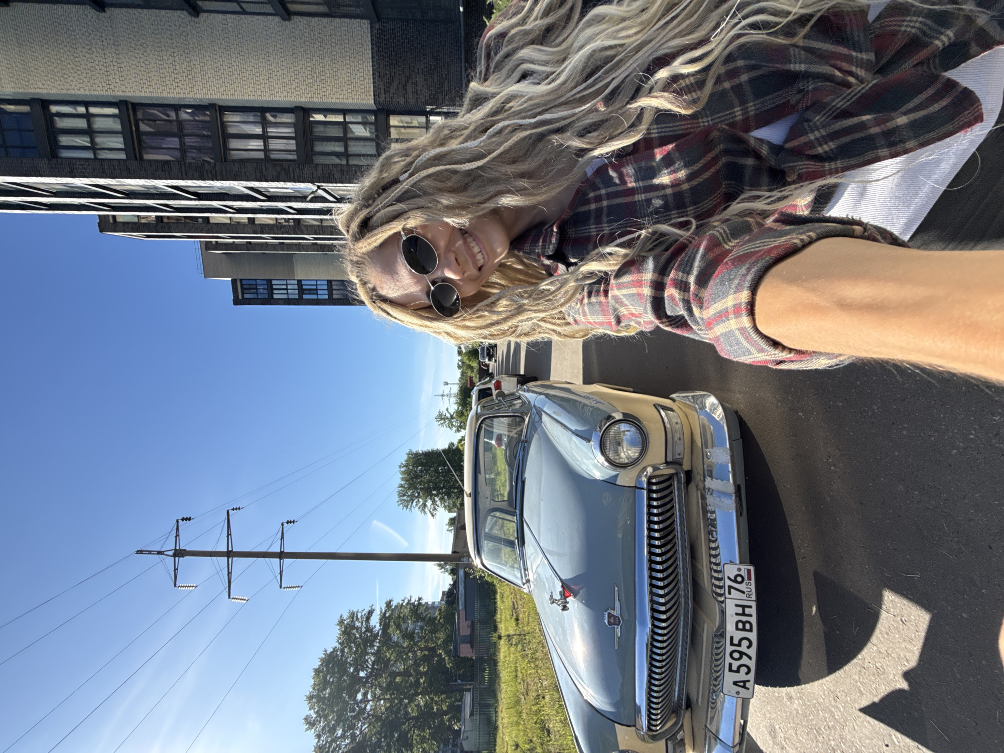 Woman takes sunny selfie in Шебунино, Russia