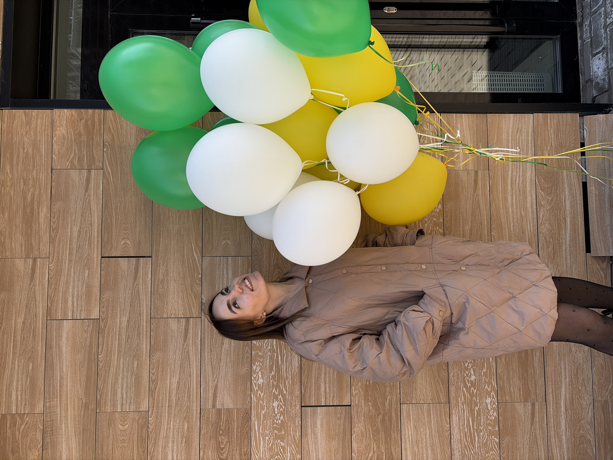 Woman photographed with colorful balloons on floor in Izhevsk