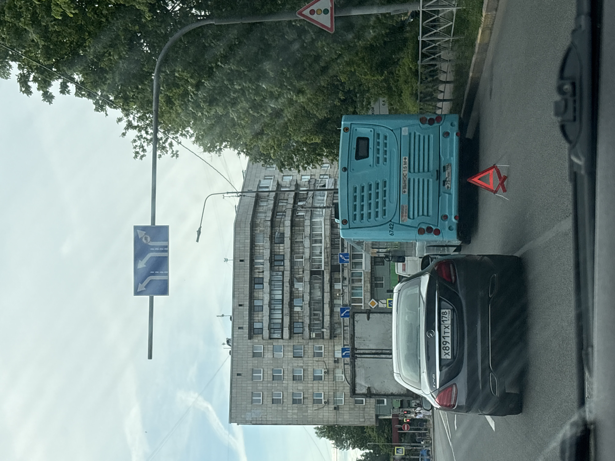Vehicle occupant documents overcast street scene in Saint Petersburg