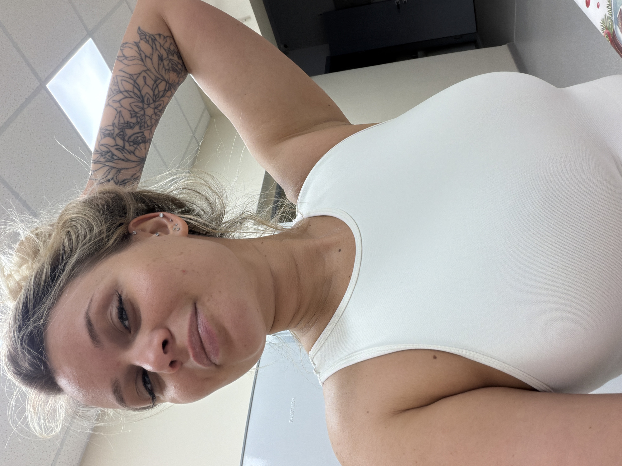 Woman takes kitchen selfies in Sarapul, Russia morning