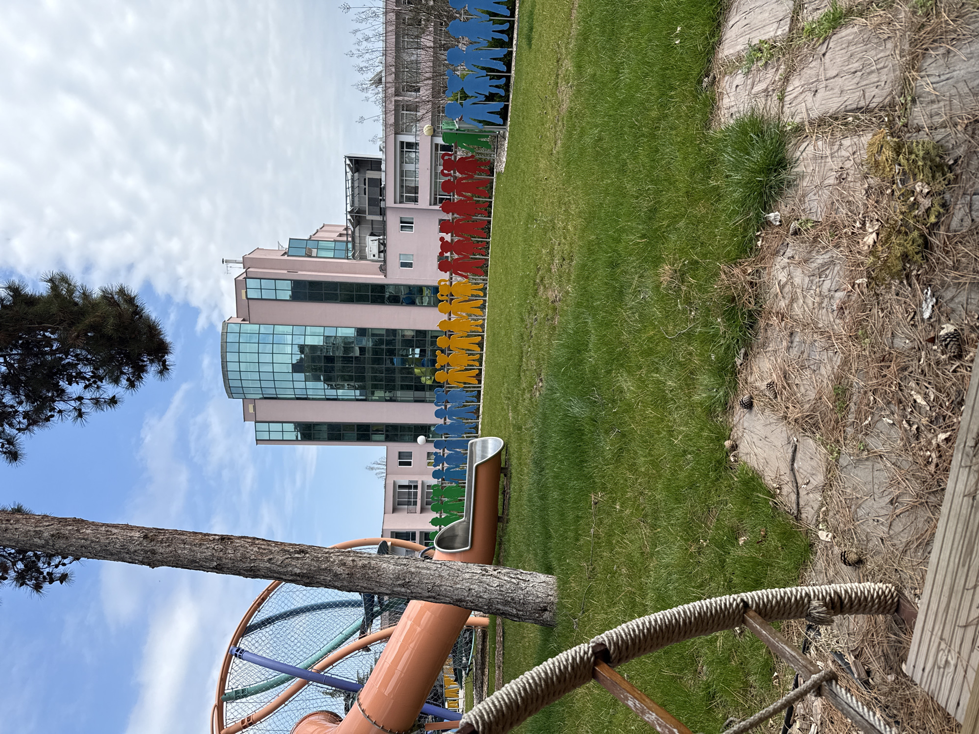 Colorful playground figures spotted near pink building in Varna