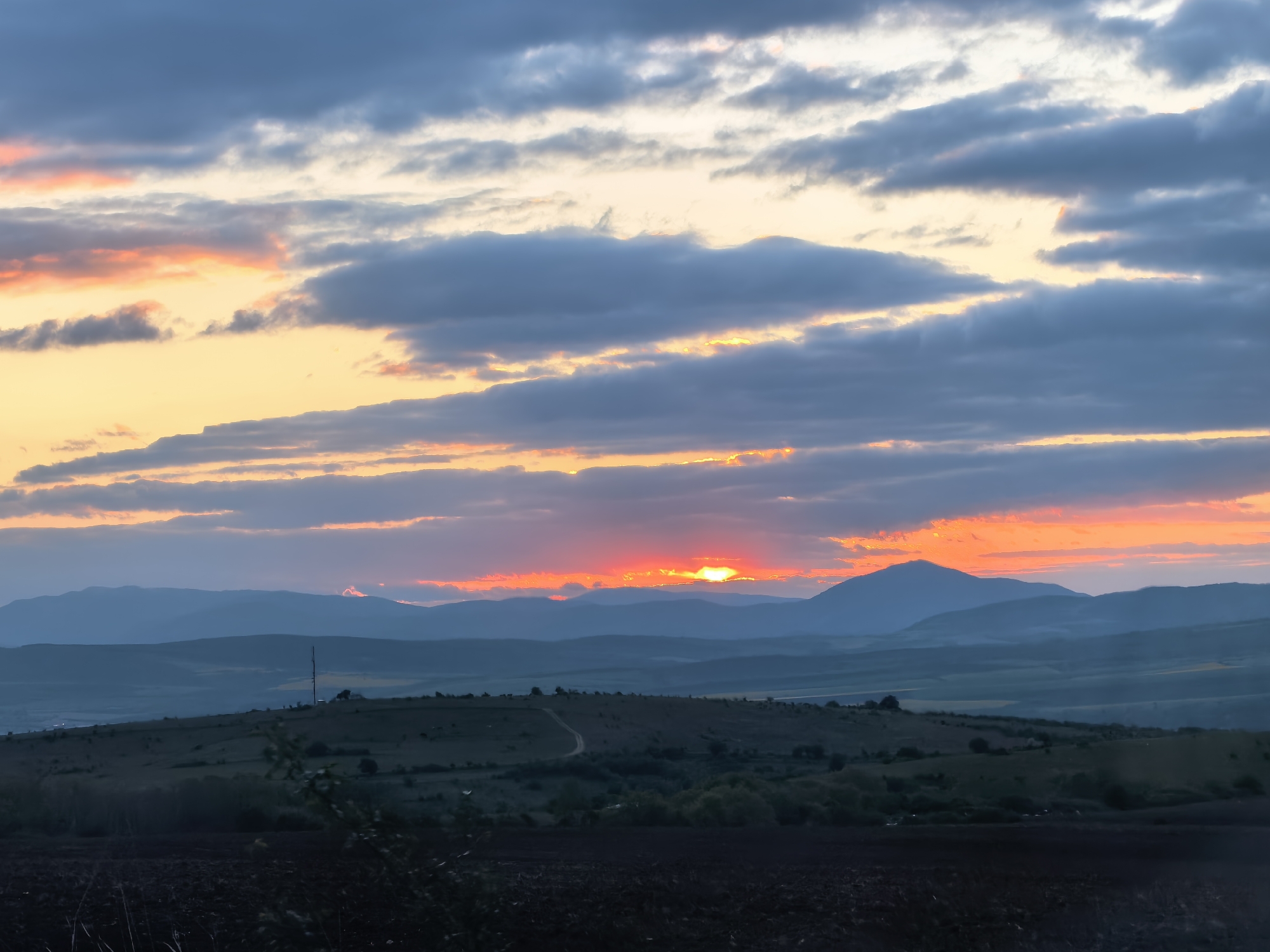 Sunset observed over hills near Sapareva Banya, Bulgaria