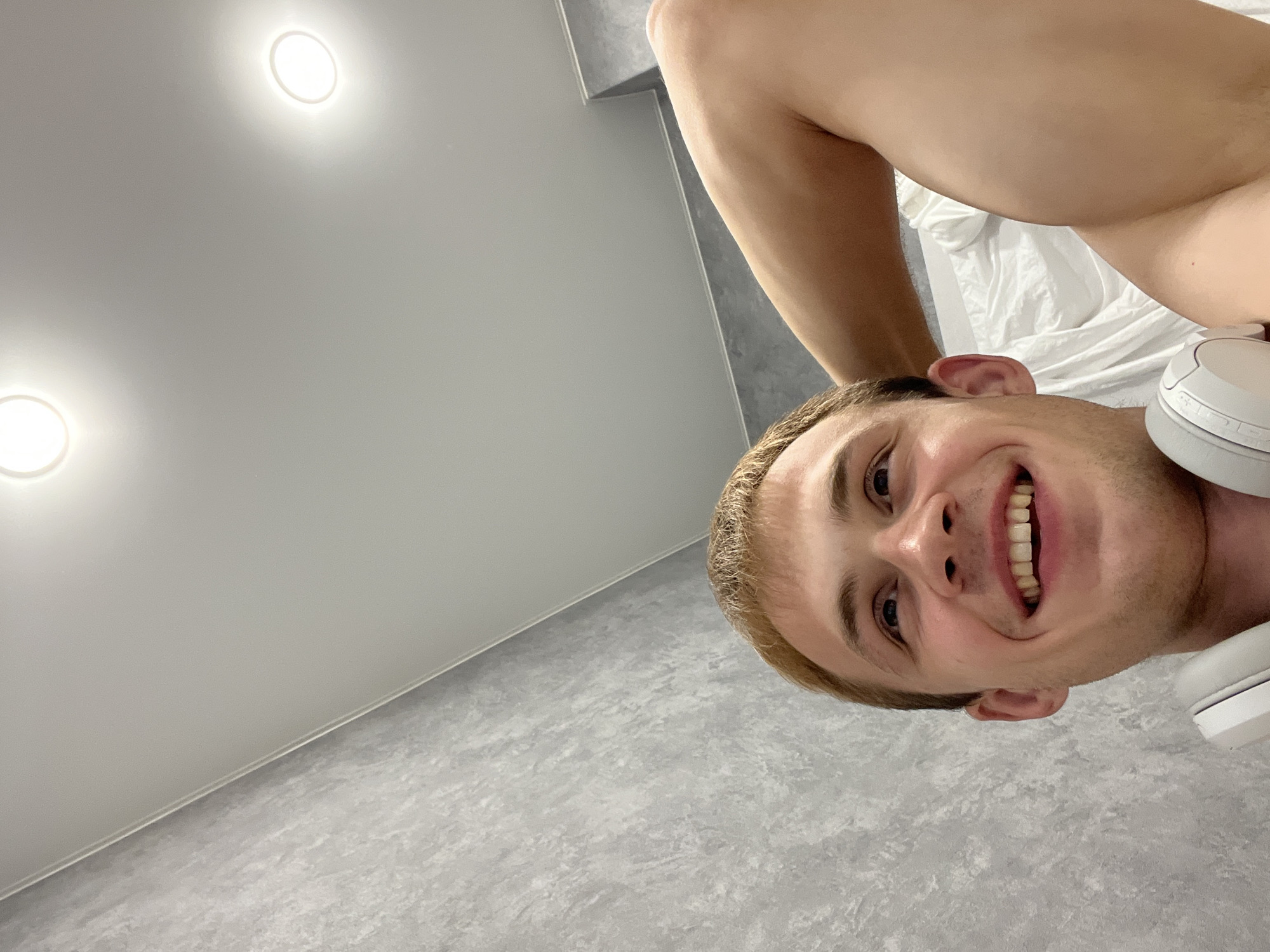 Indoor workout and selfie session with white headphones