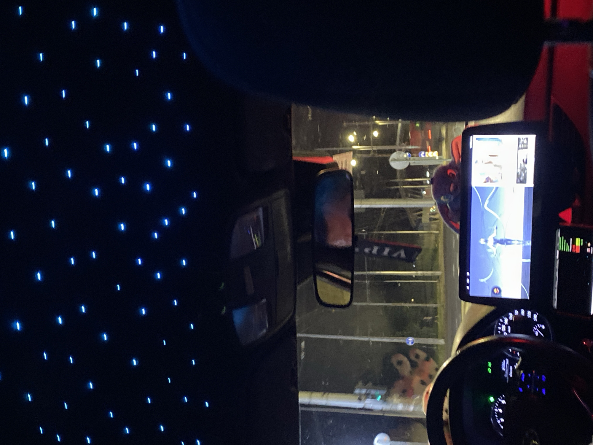 Car interior with blue ceiling lights, nighttime Burgas