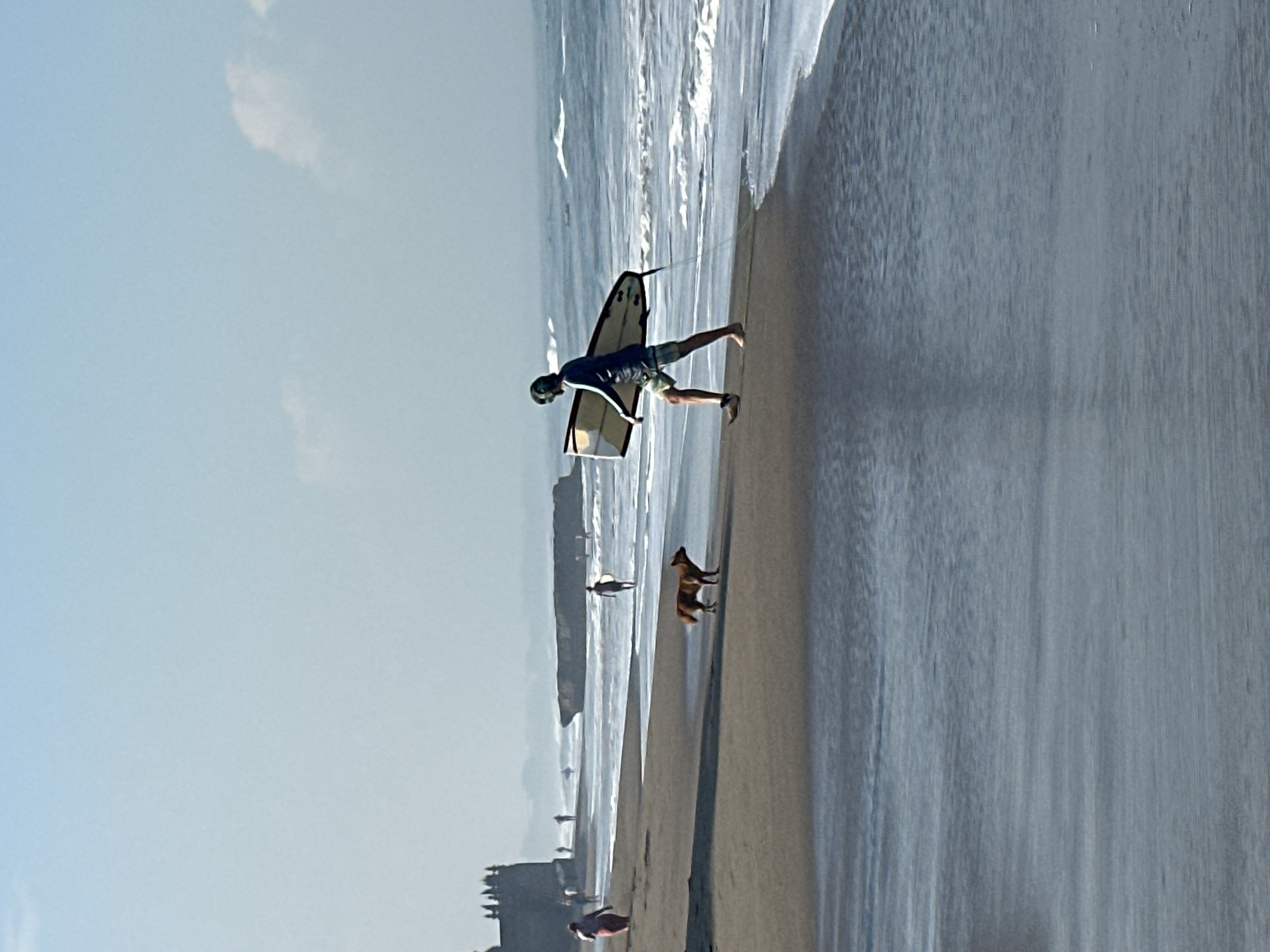 Early morning beach activity captured in North Kuta, Indonesia