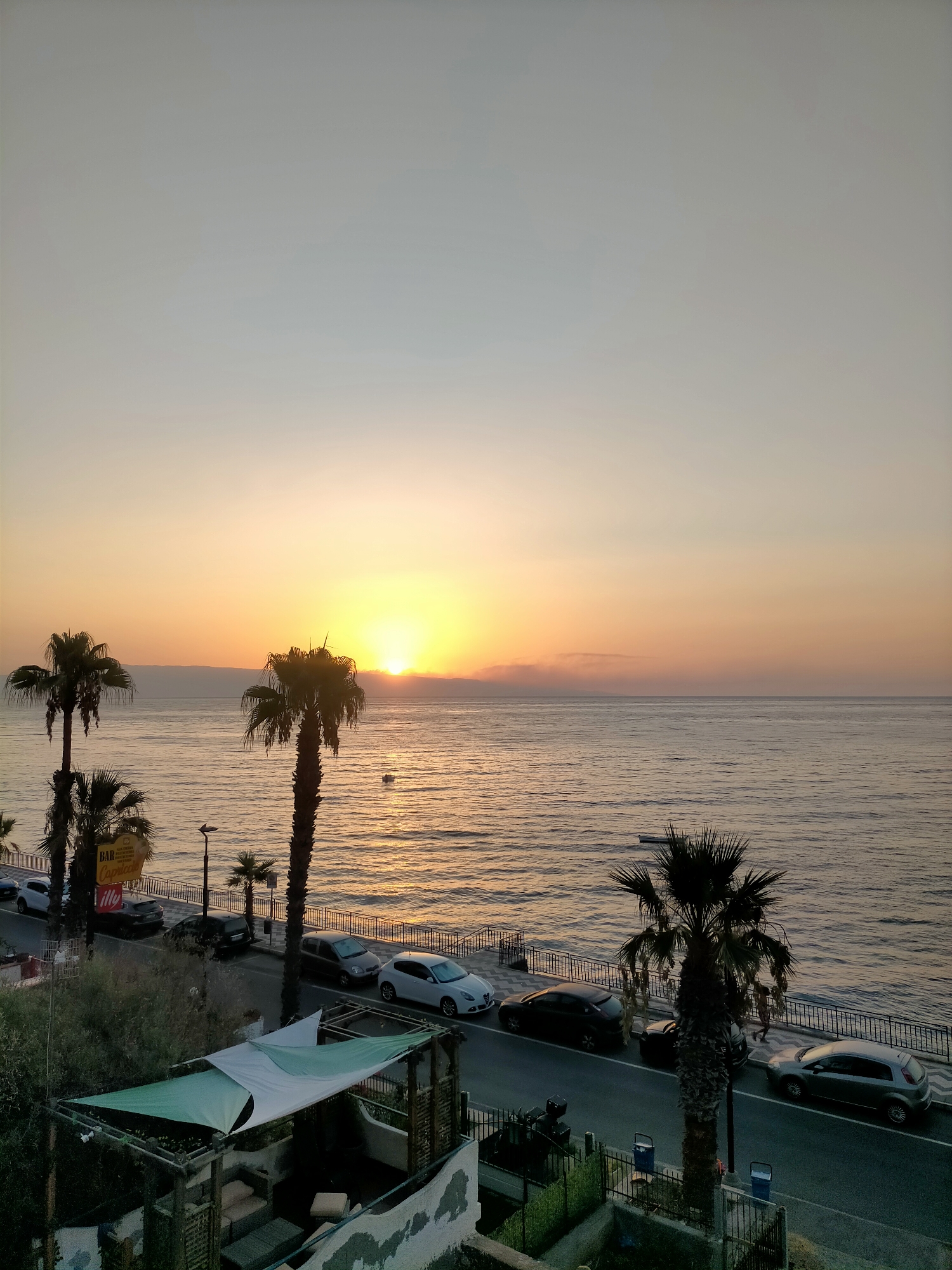 Sunrise over a calm coastal promenade, multiple angles