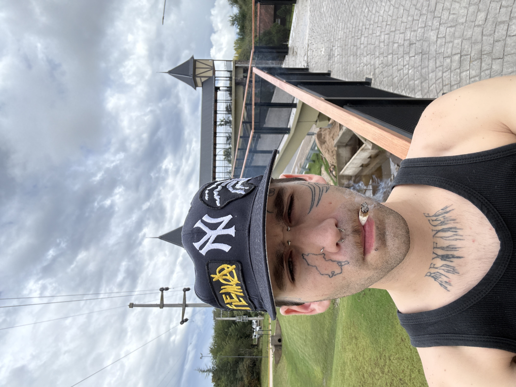 Man takes selfie on pedestrian bridge in Villa General Belgrano