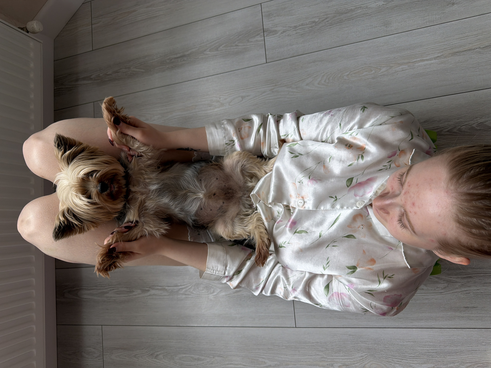 Woman enjoys Sunday morning relaxation with dog in Russia