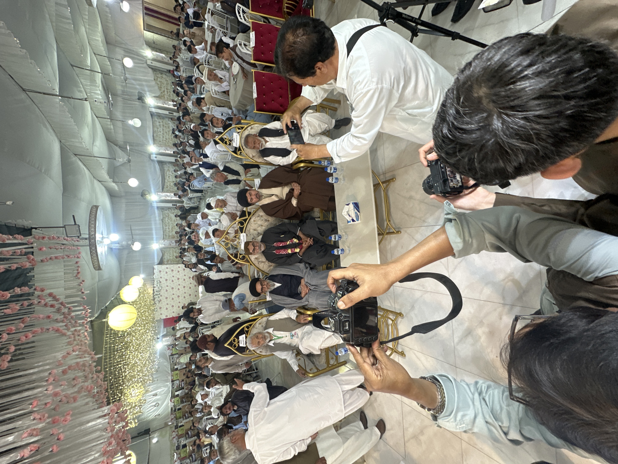 Men seated on golden chairs photographed at Quetta gathering