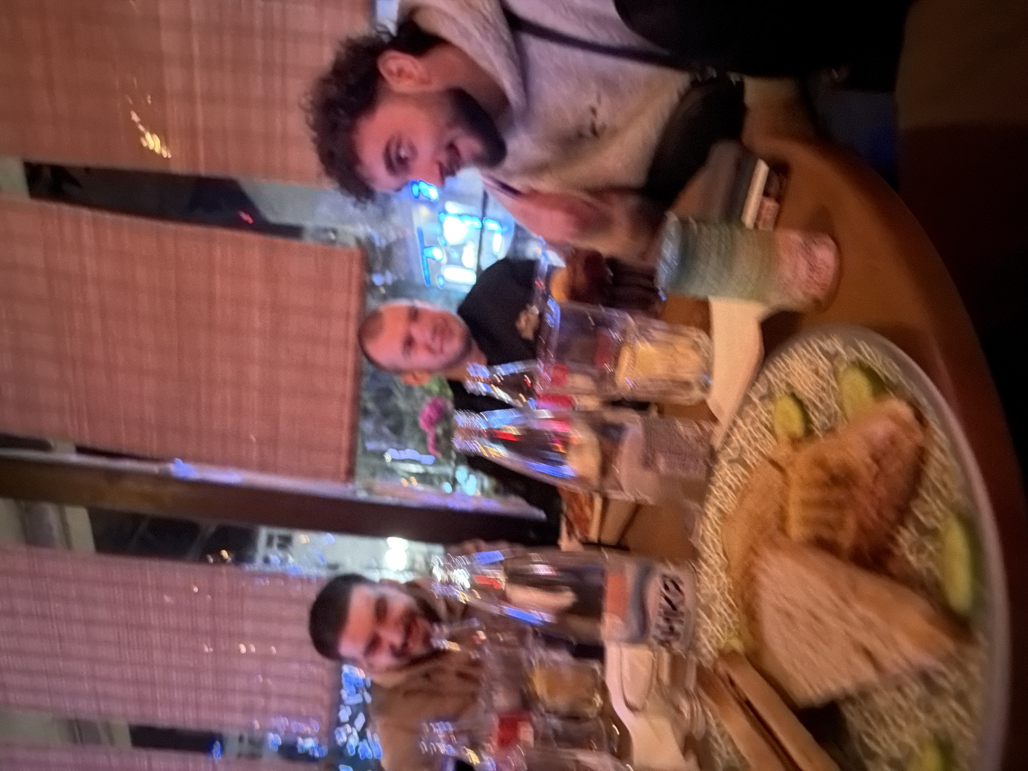Three men dine together at restaurant in Chirpan