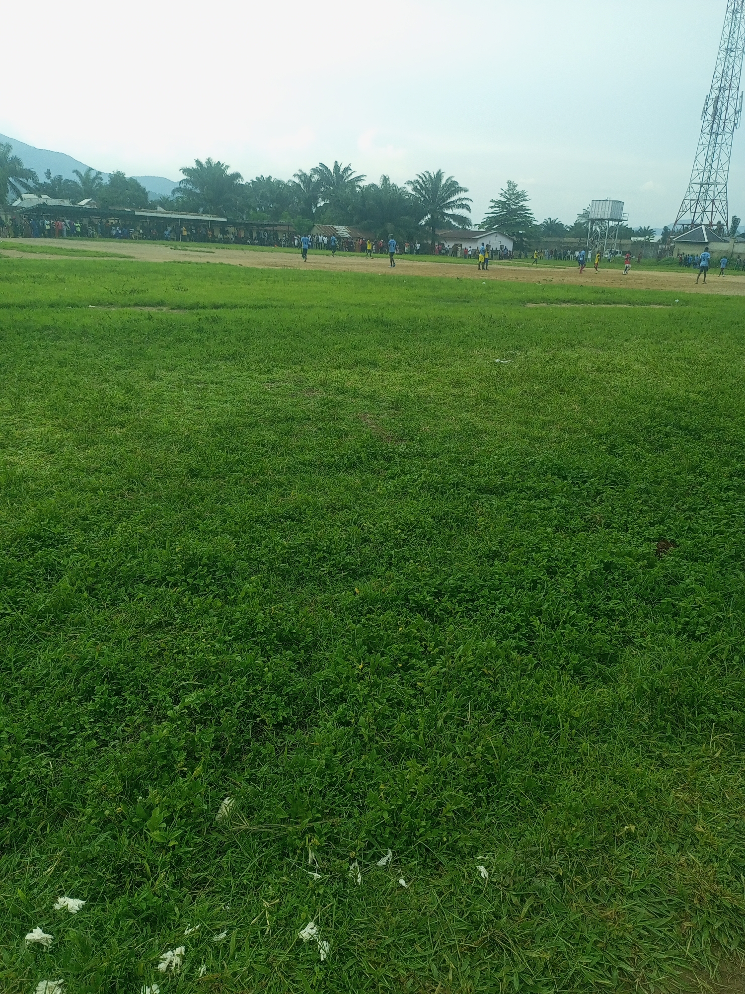 Afternoon soccer match on a grass field in Serti, Nigeria