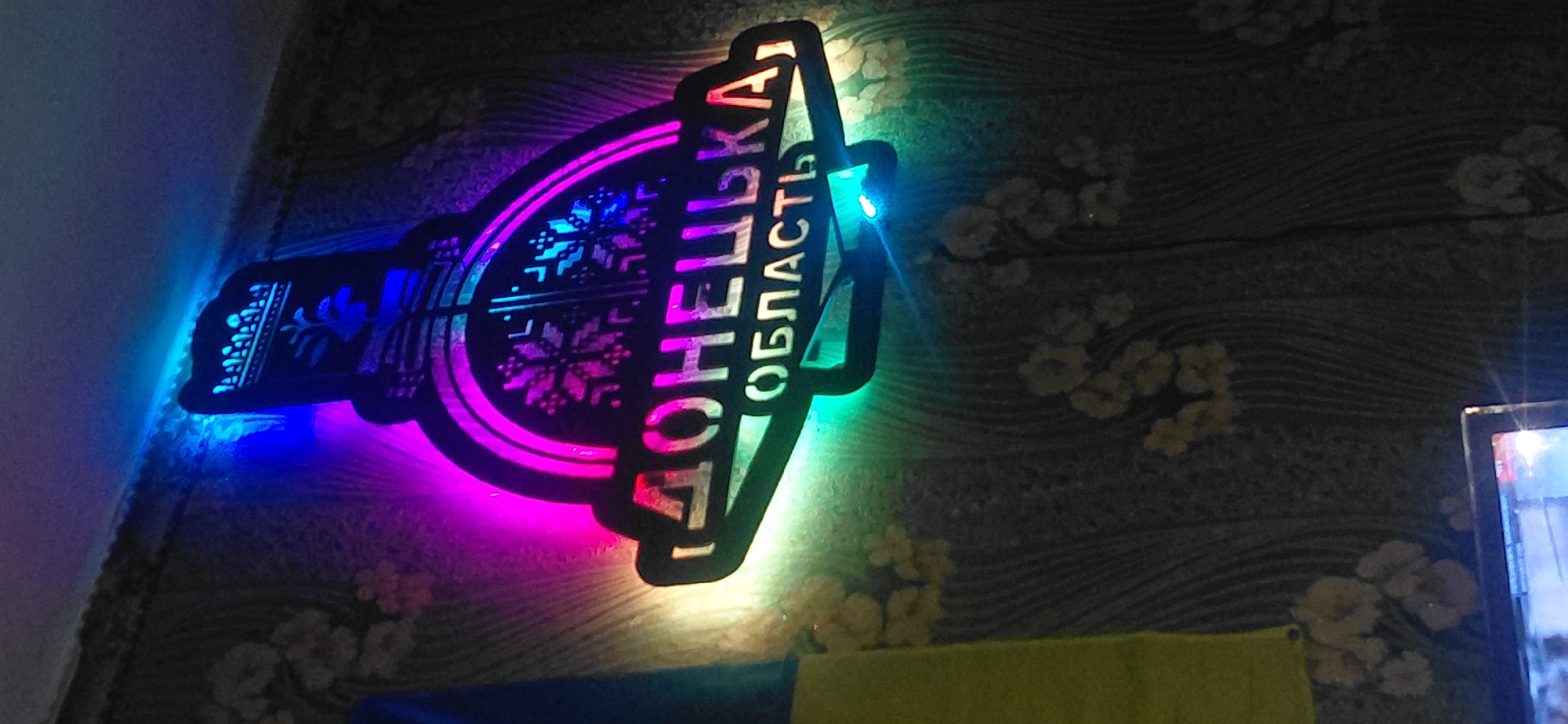 Inside a Ketrysanivka building with Donetsk Oblast signage, late evening