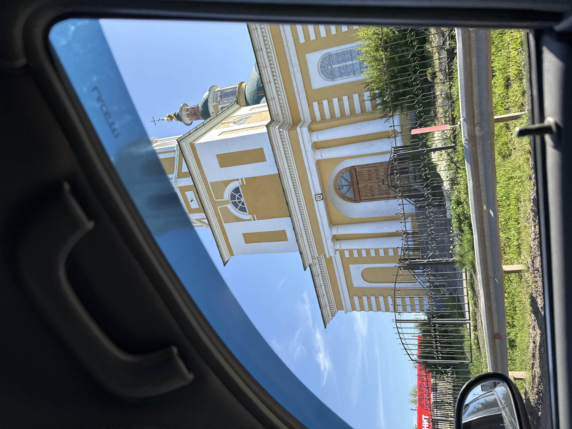 Church photographed from car window in rural Russia