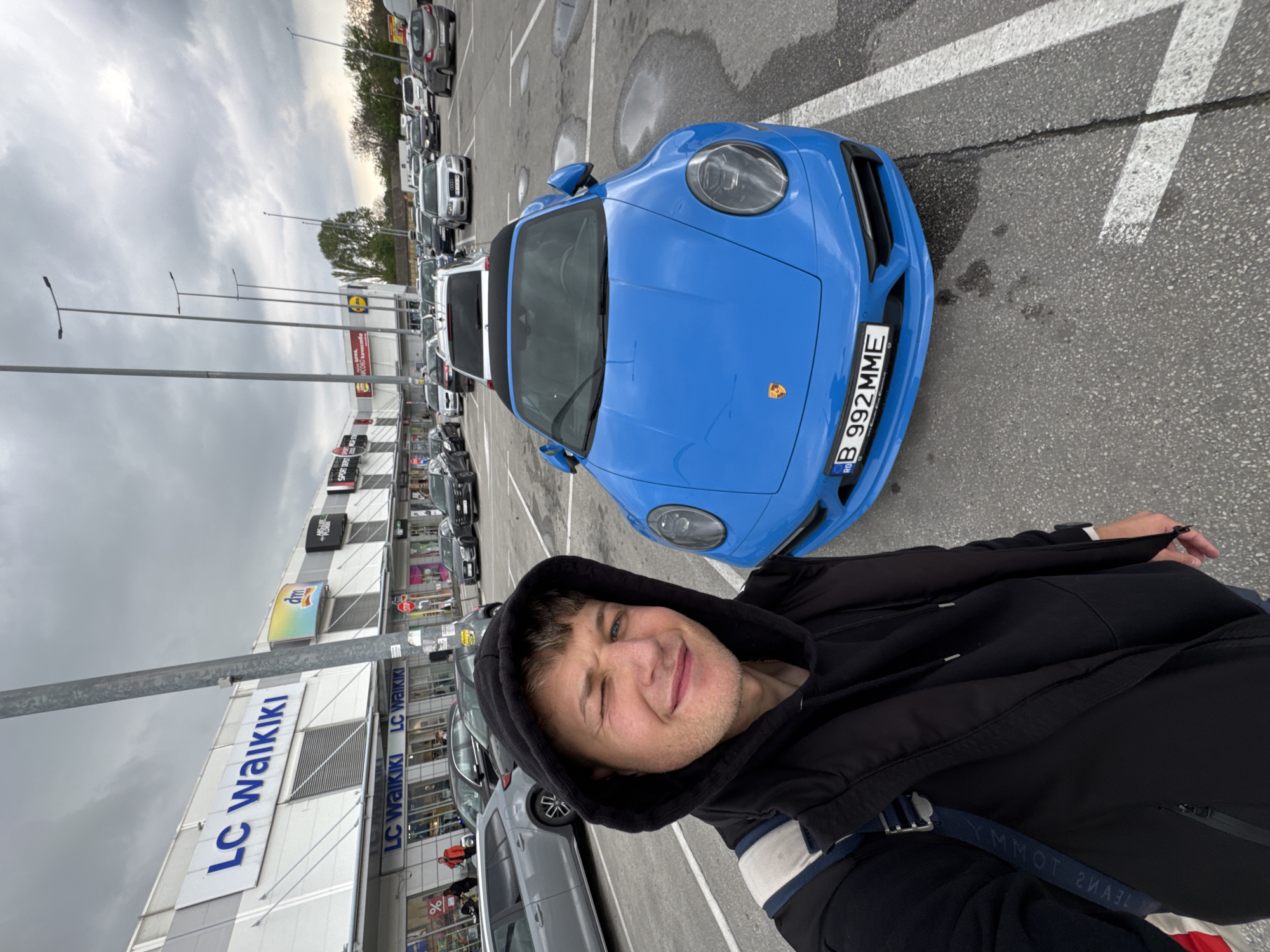 Tourist documents luxury cars during Plovdiv shopping center visit