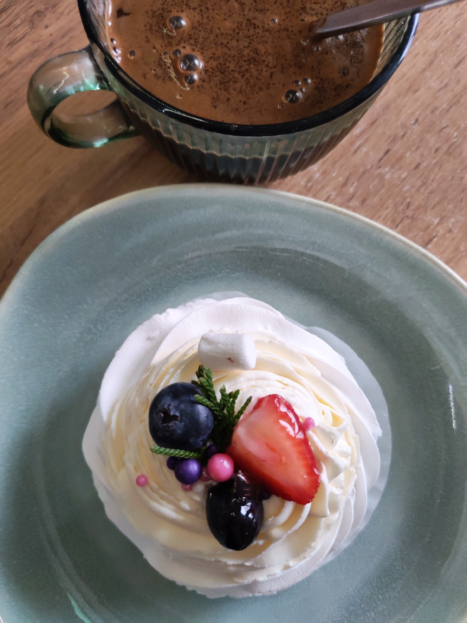 Elaborate dessert presentation documented in Izhevsk cafe setting
