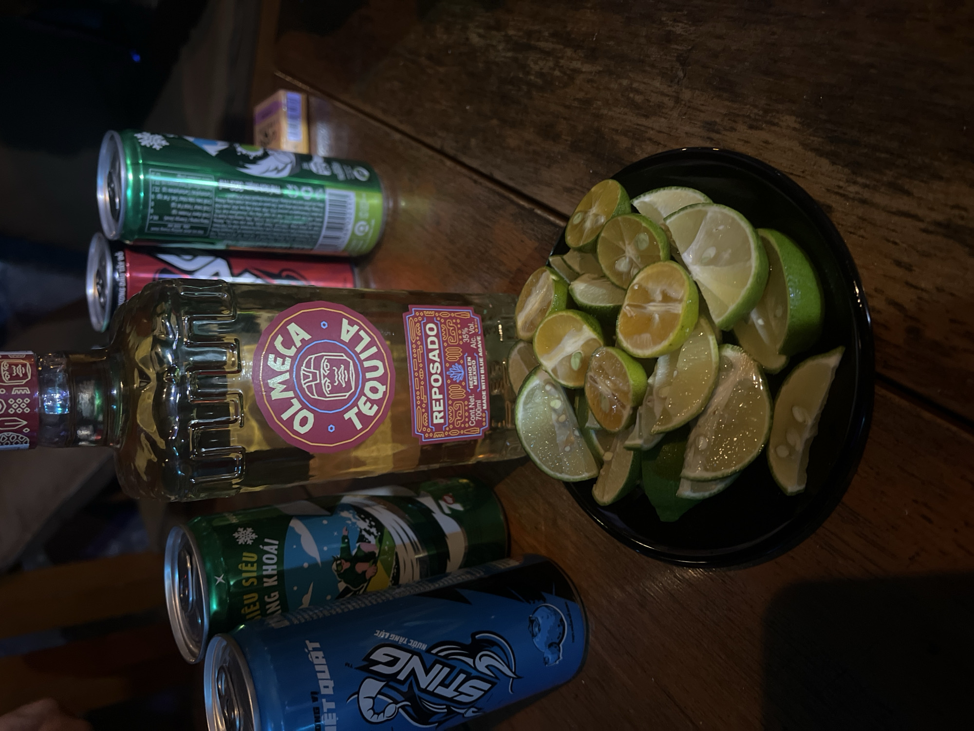 Olmeca Reposado and lime wedges on a table in Phú Quốc