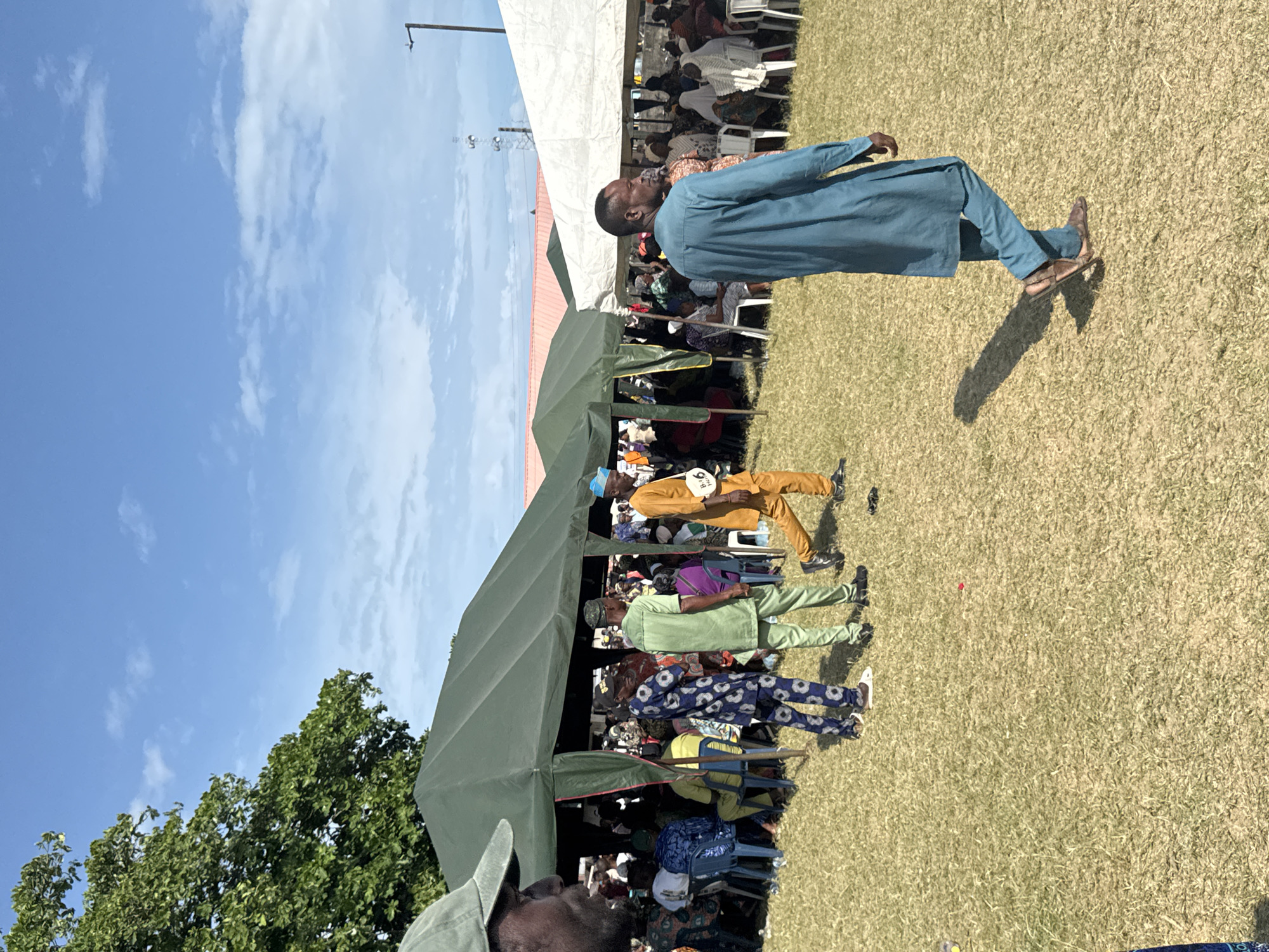 Public gathering with tents and flags held in Badagry
