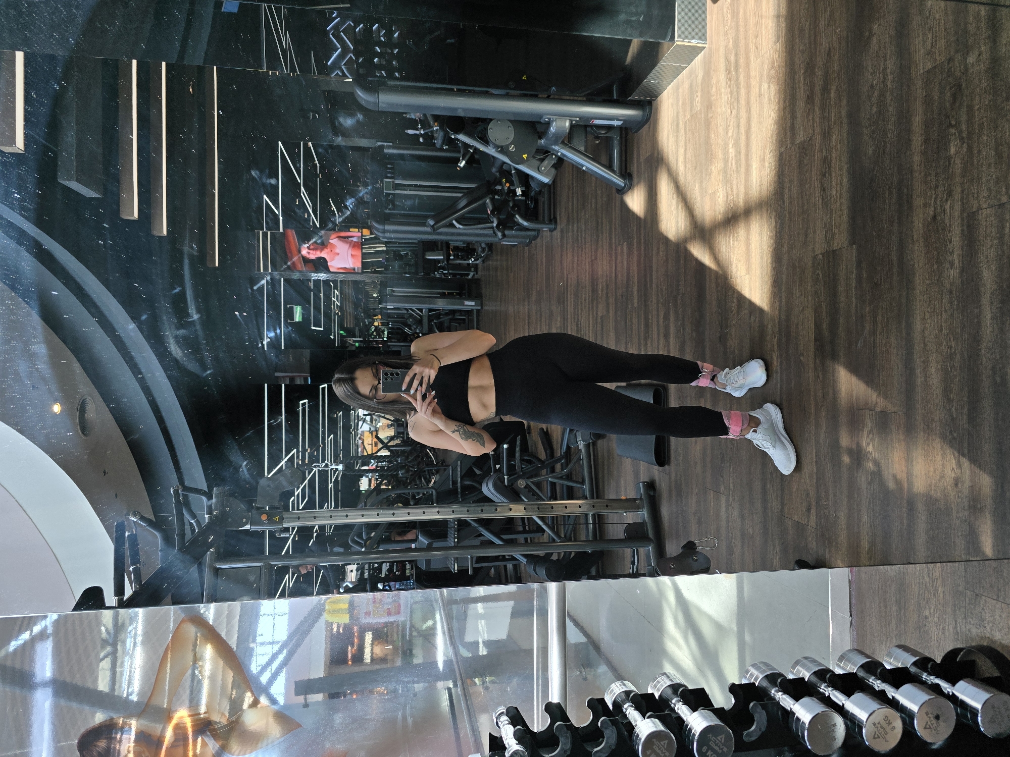 Woman takes gym mirror selfie in Burgas, Bulgaria
