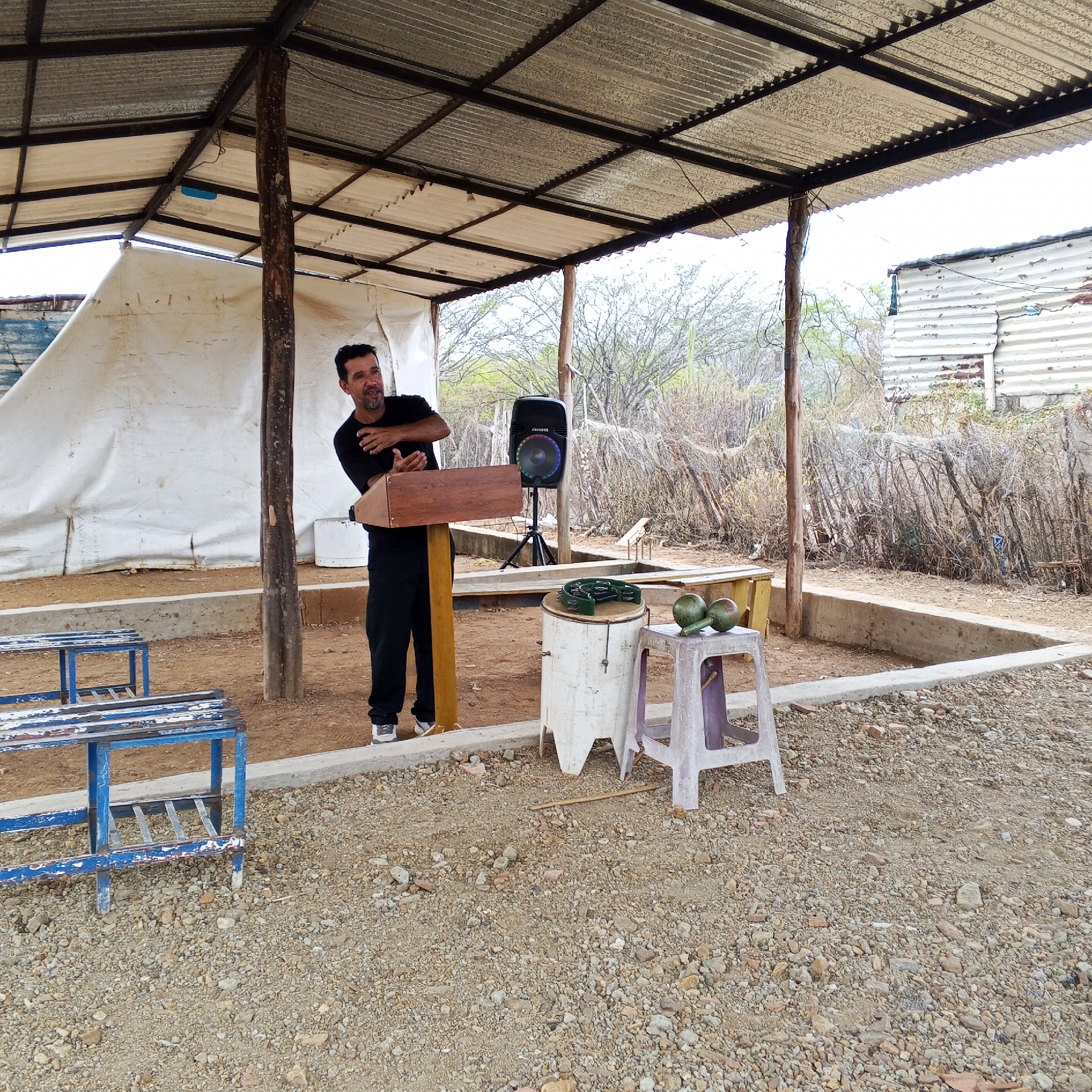 Daily life scenes: outdoor speech, beached boats, gas station