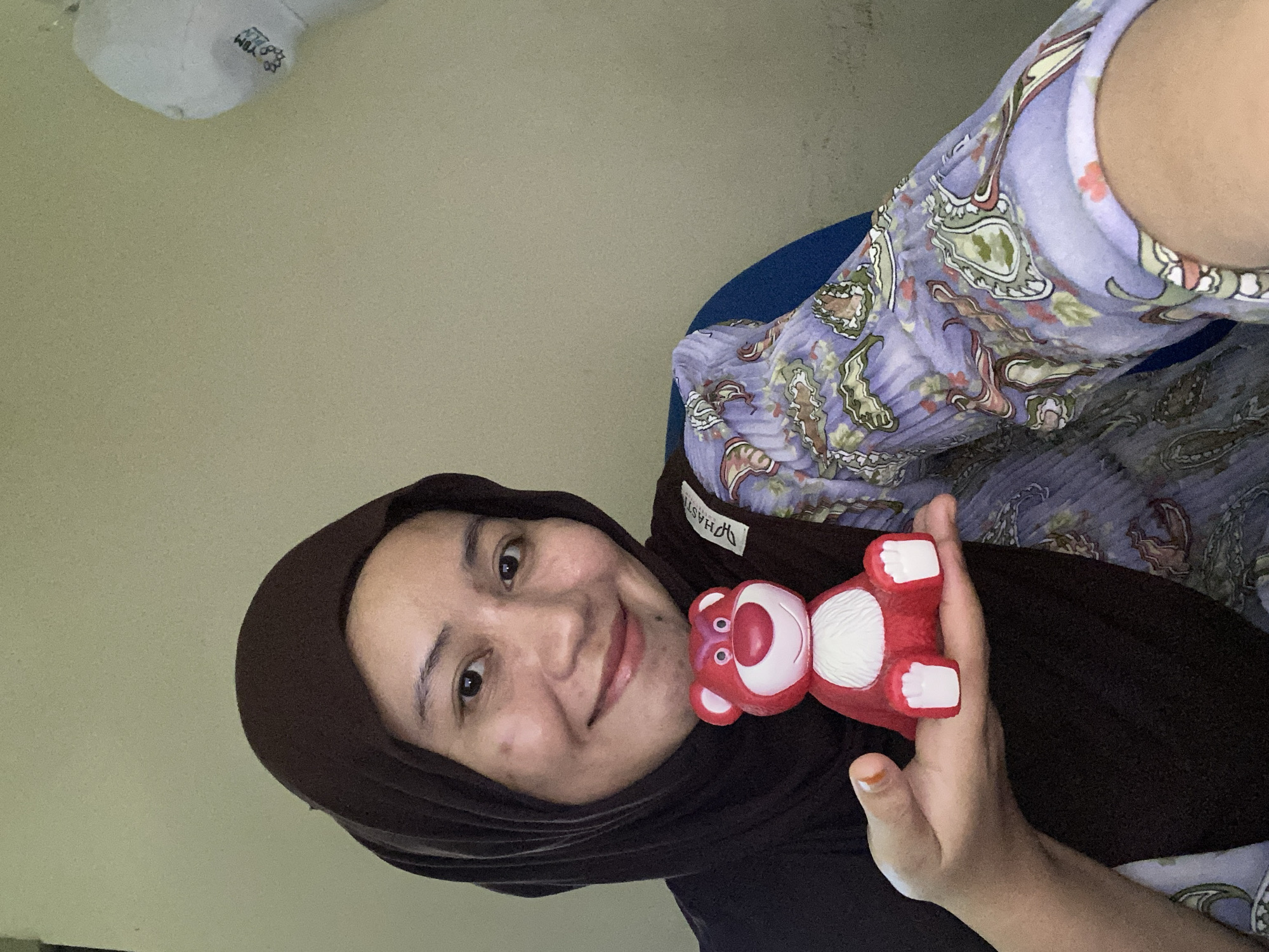 Playful selfie session in Banjarbaru with a Lotso bear