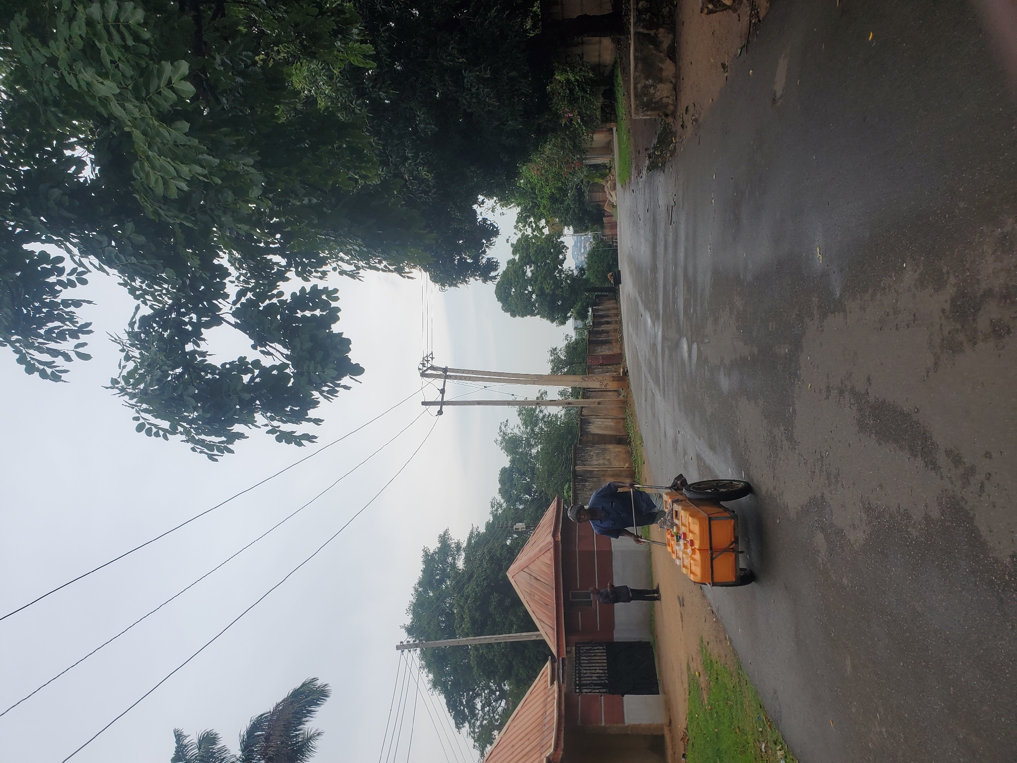 Overcast afternoon street life in Jos, Nigeria neighborhoods