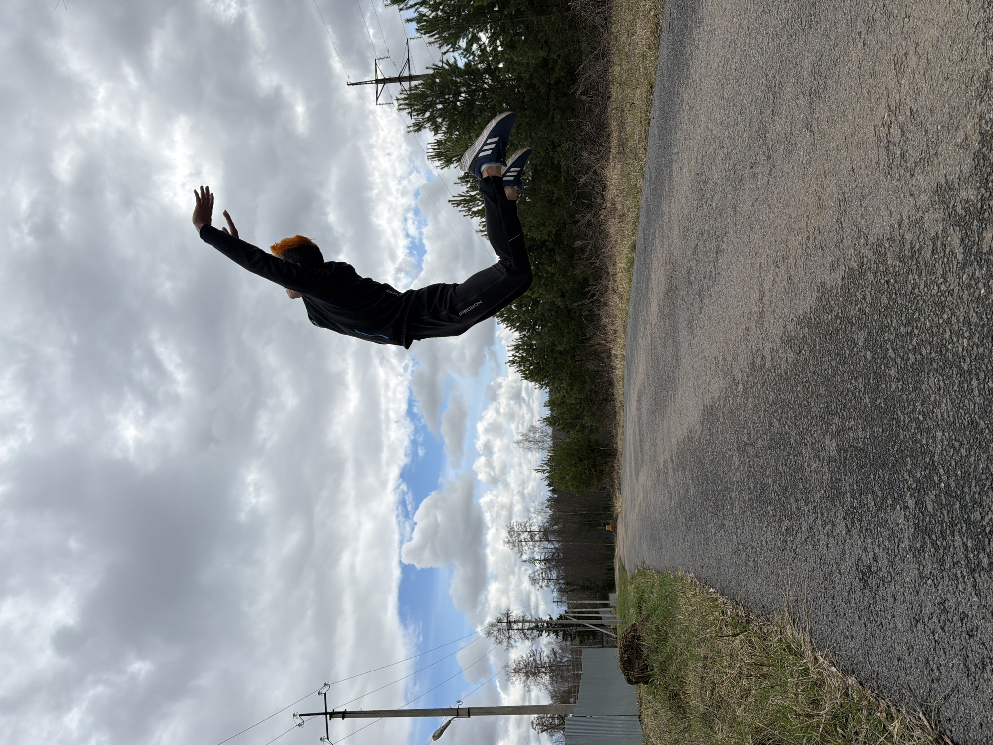Orange-haired person performs acrobatic moves in Chaikovsky, Russia