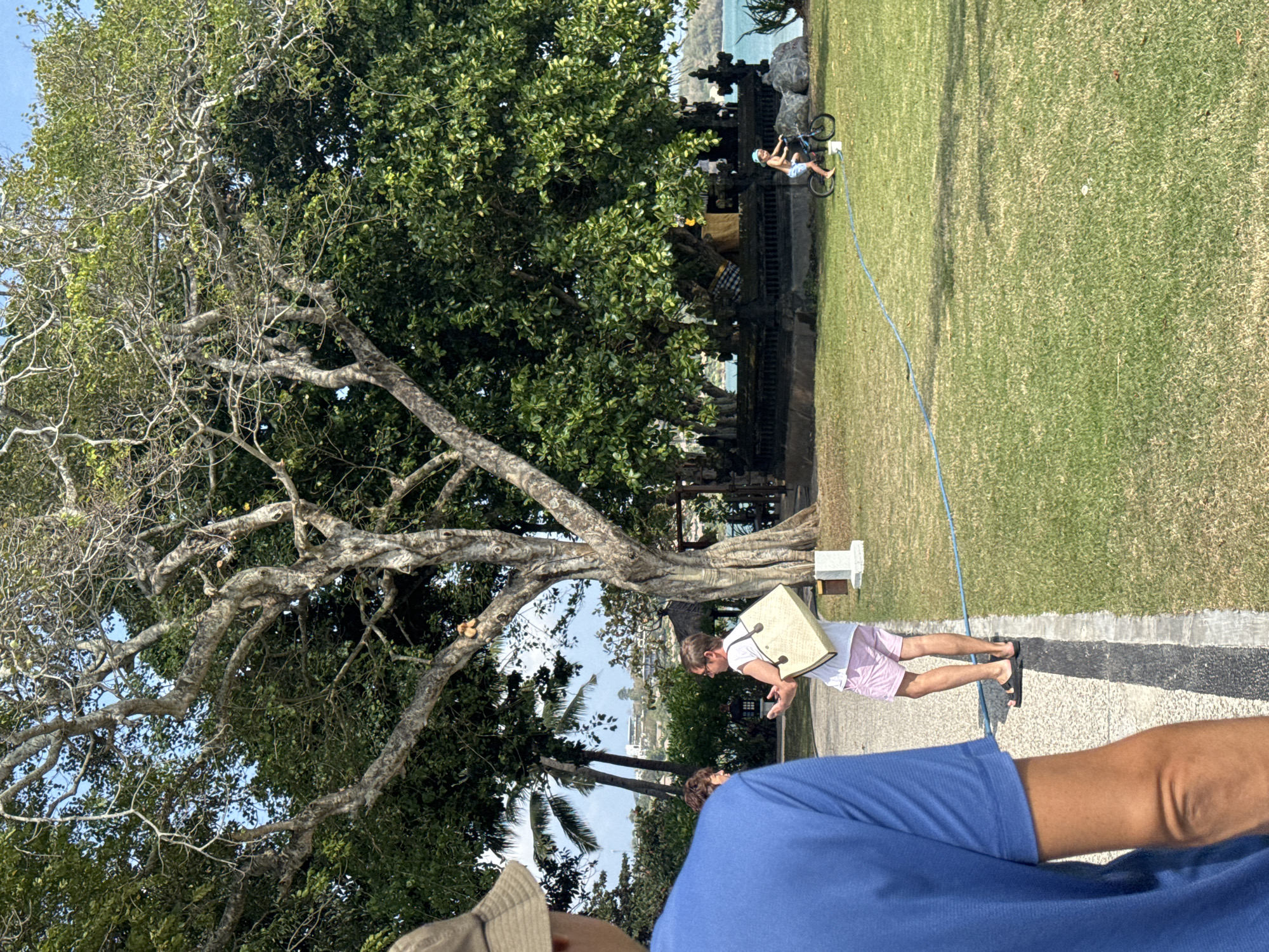 Tent assembly underway on a coastal field in Kuta Selatan