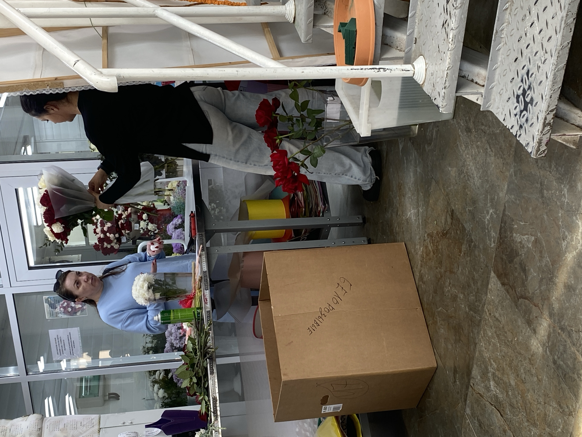 Florist arranges bouquets at Yekaterinburg flower shop Thursday morning