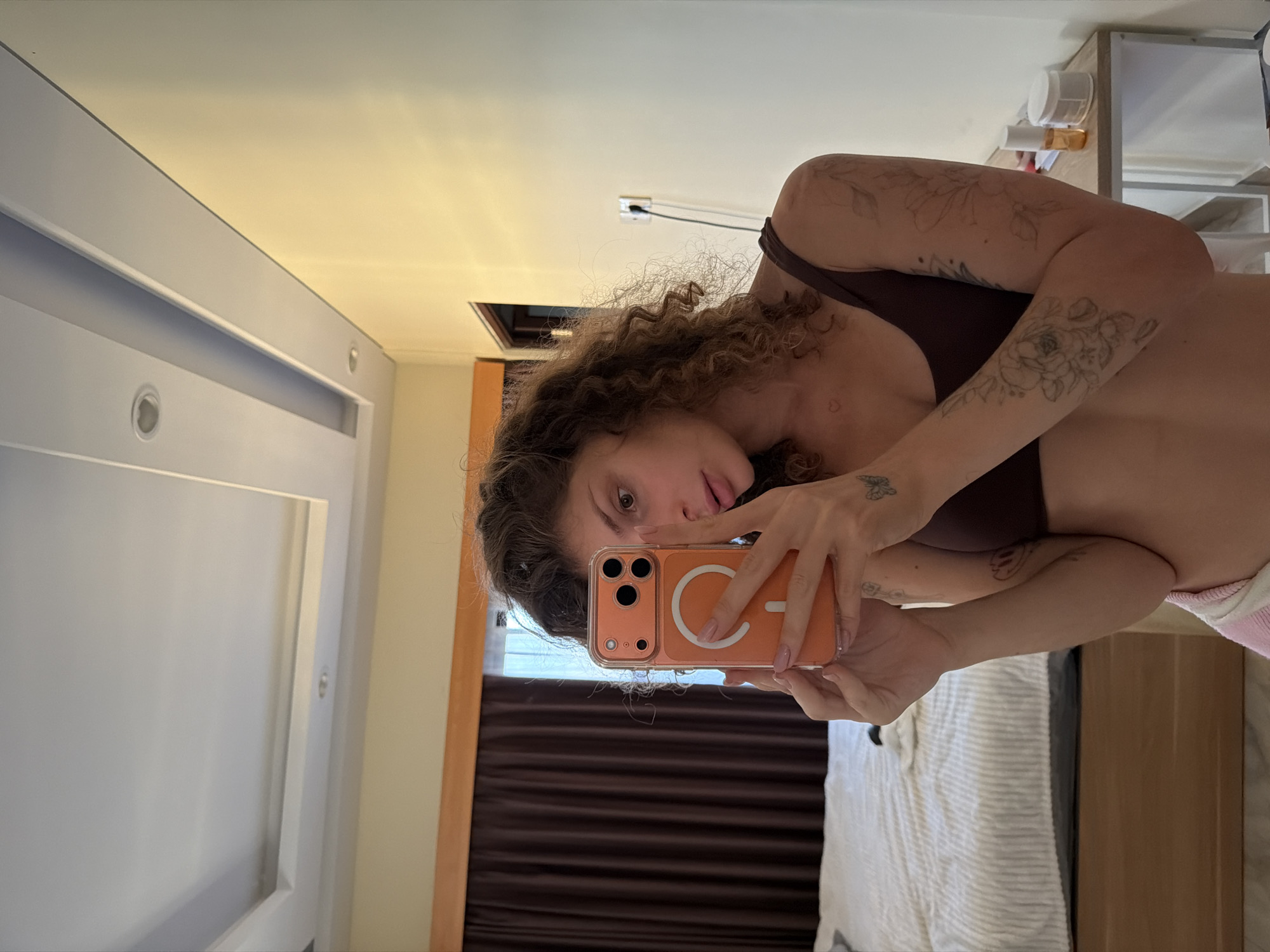 Woman takes selfies in North Kuta bedroom