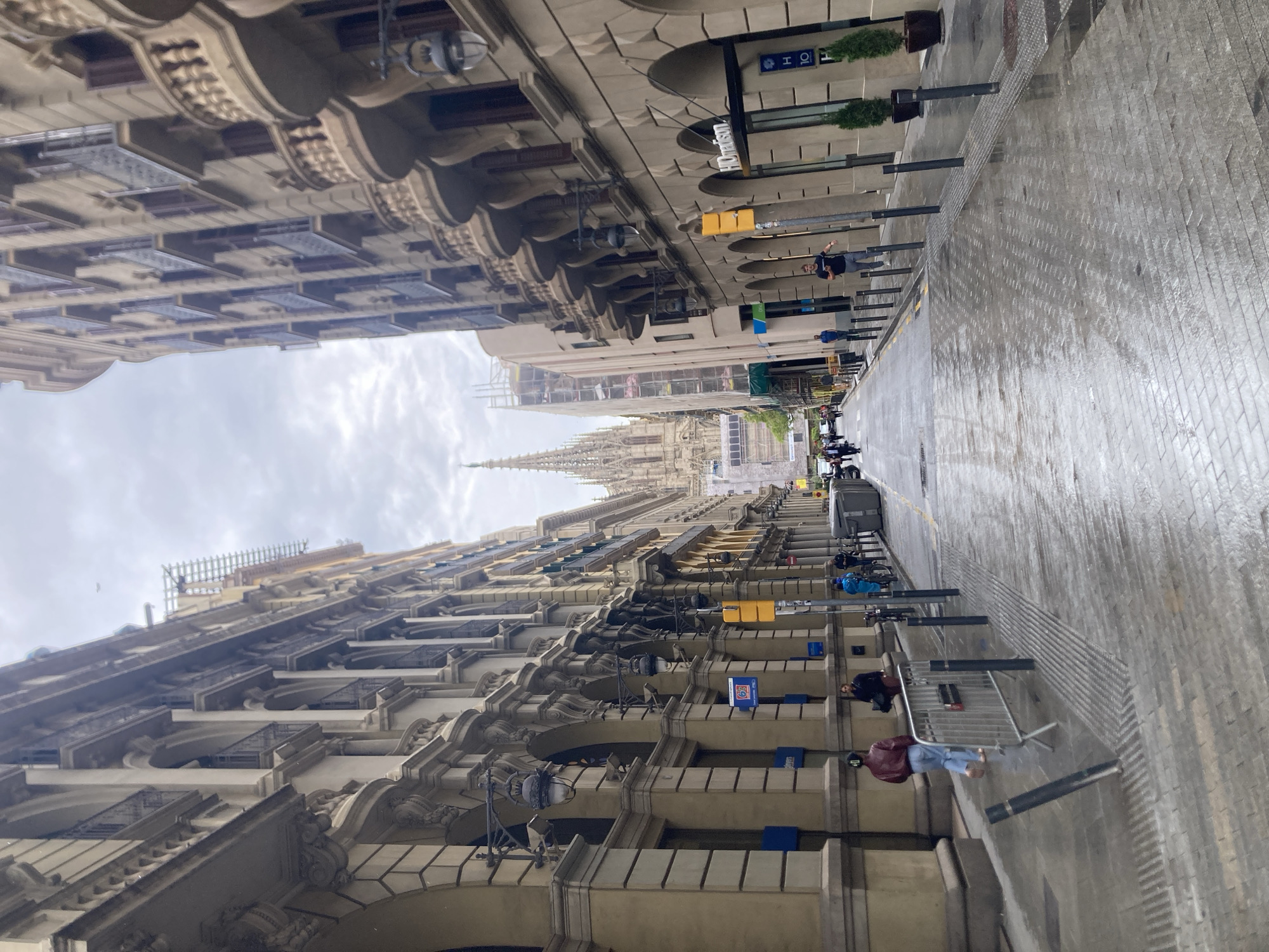 Wet streets and classical architecture observed in Barcelona