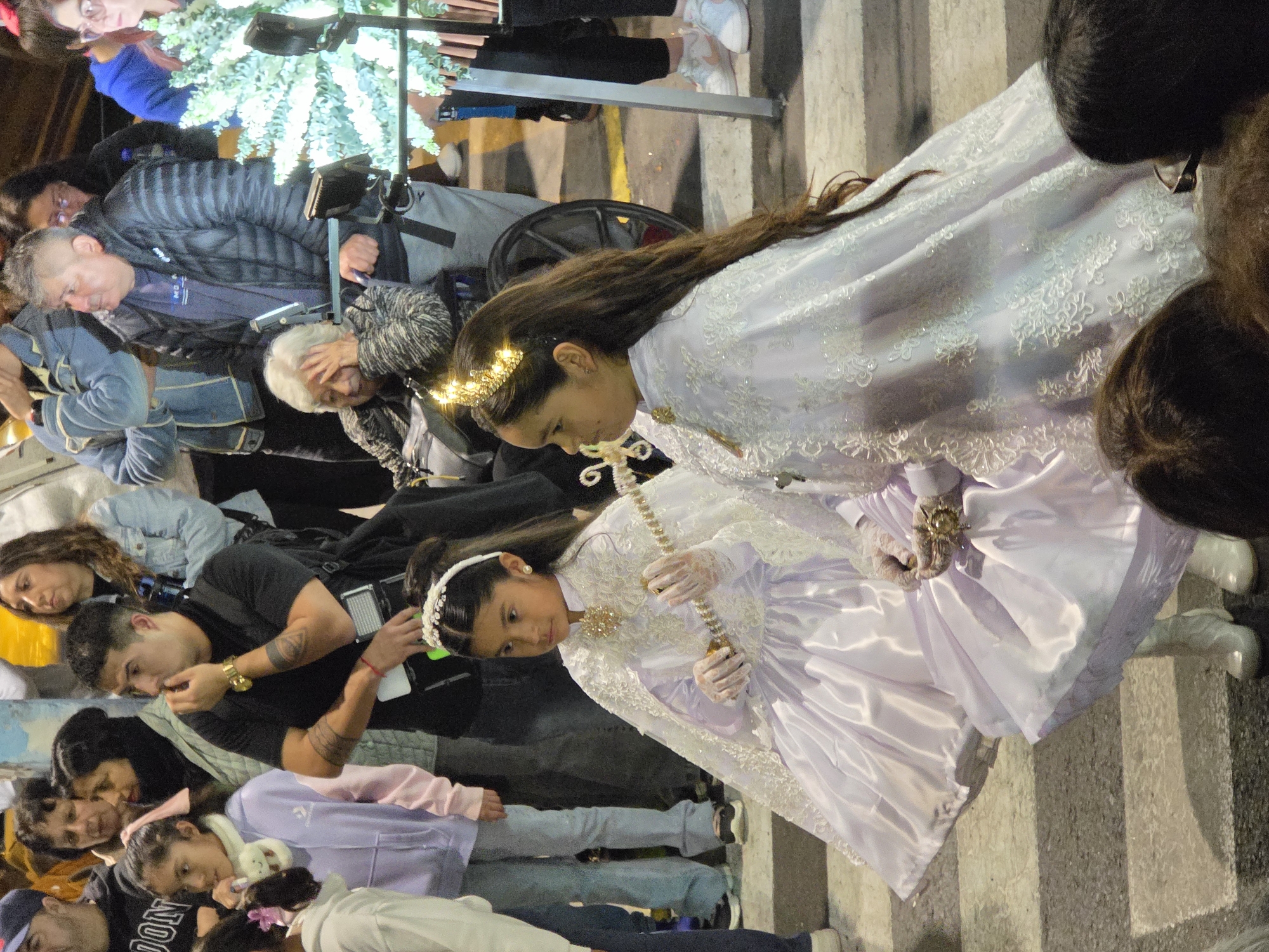Festive night parade in Iquique, Chile, with ornate traditional dress
