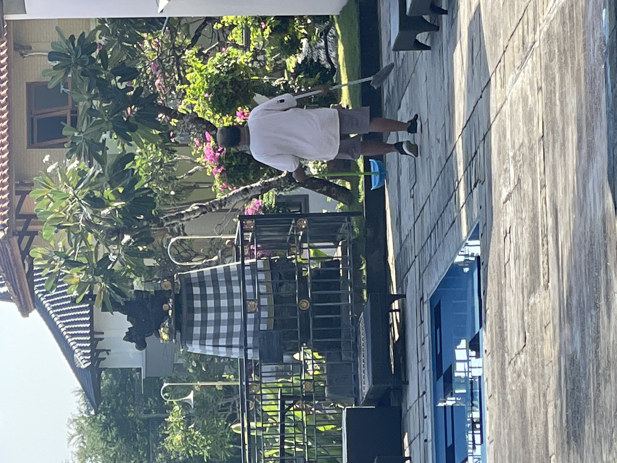 Early morning poolside activities at Kuta Selatan resort facility