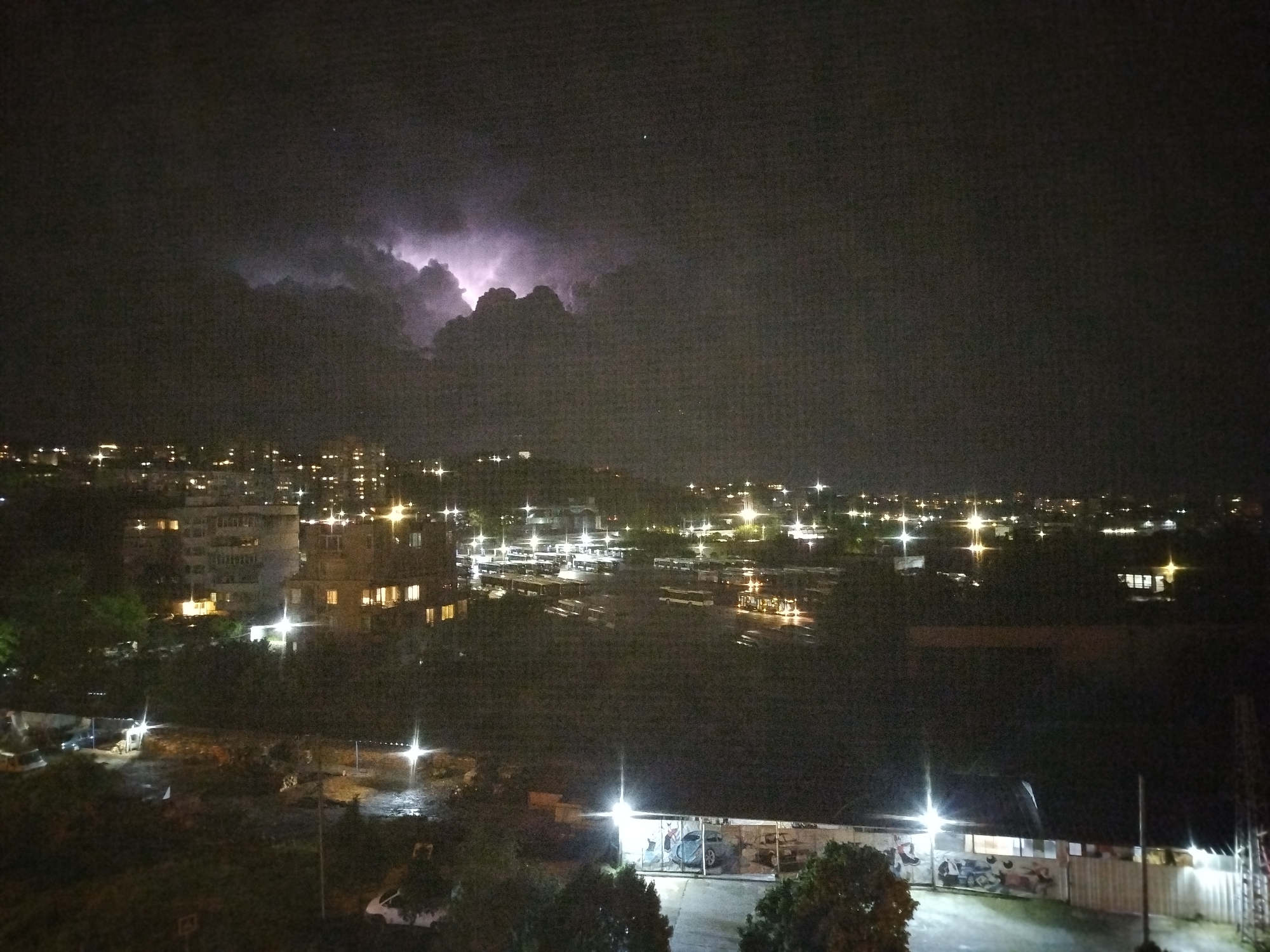 Lightning storm illuminates Varna, Bulgaria cityscape during evening hours