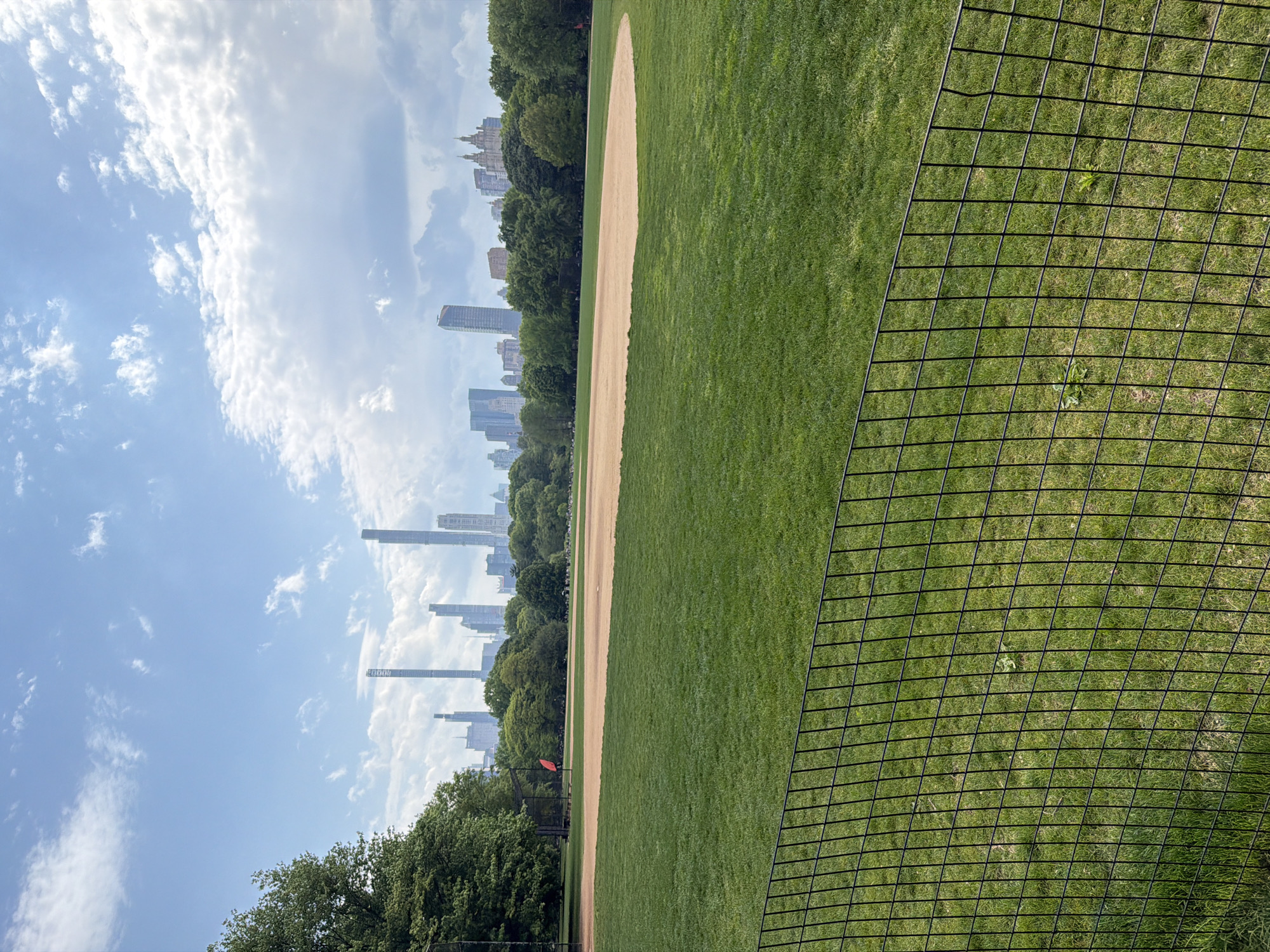 Baseball field observed in Central Park on spring evening