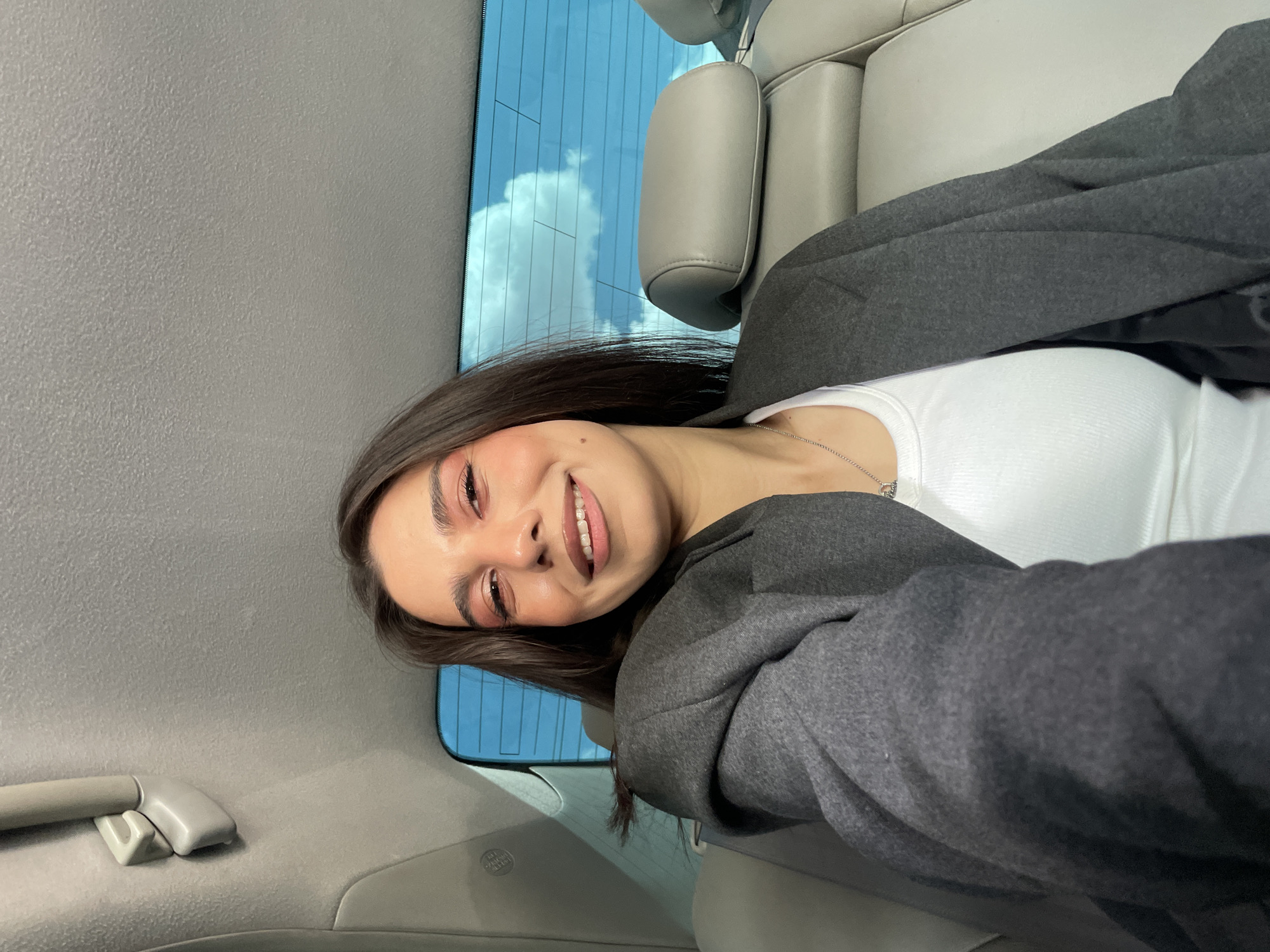 Woman smiles in car in Yerevan, Armenia