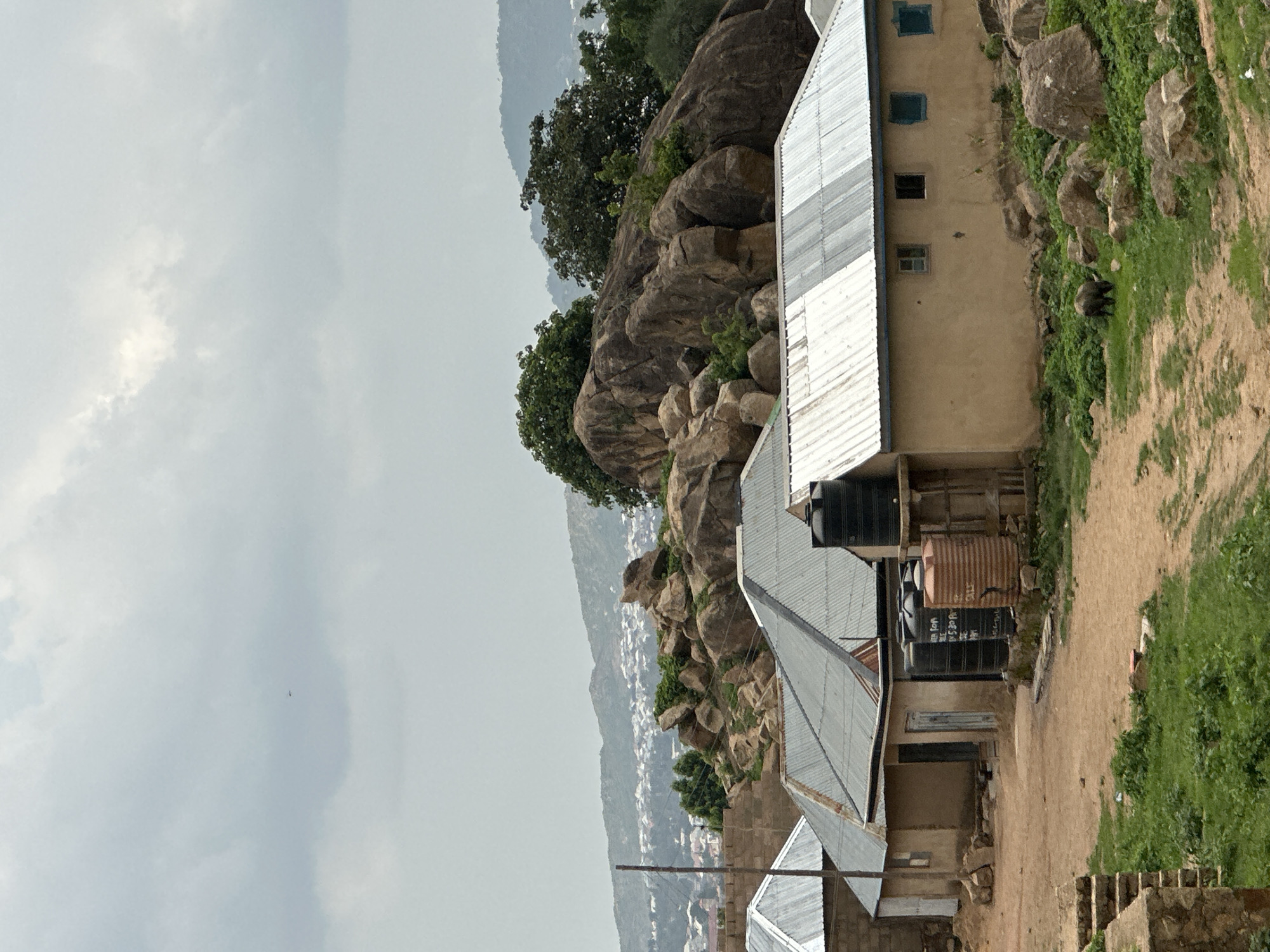 Witness documents Jos Nigeria landscape under overcast afternoon skies