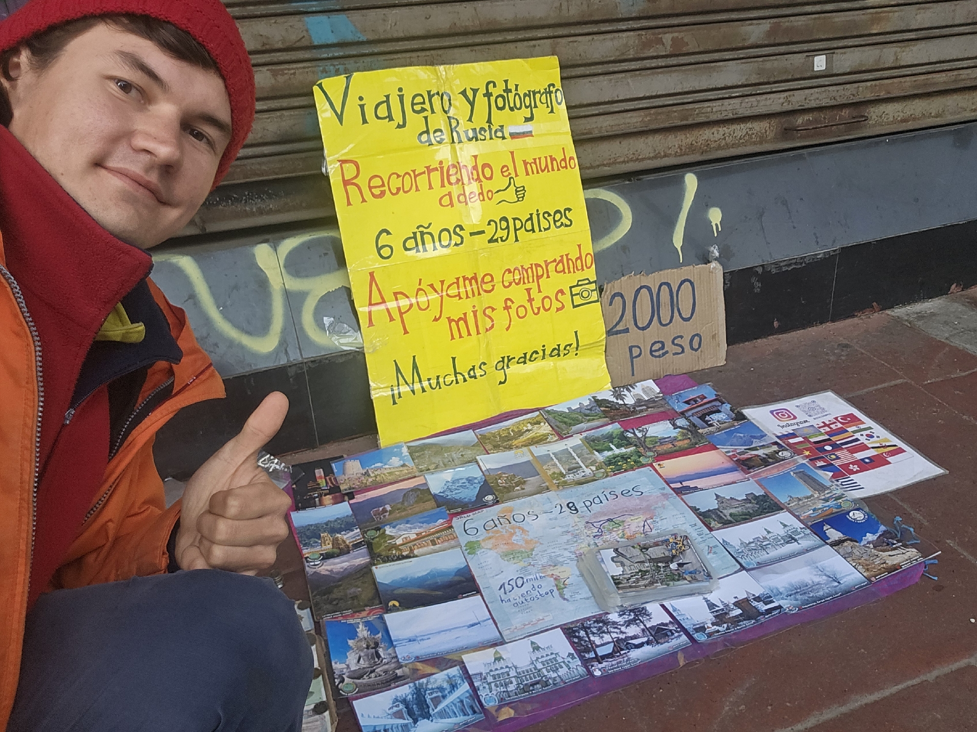 Russian traveler sells postcards, currency on Osorno streets