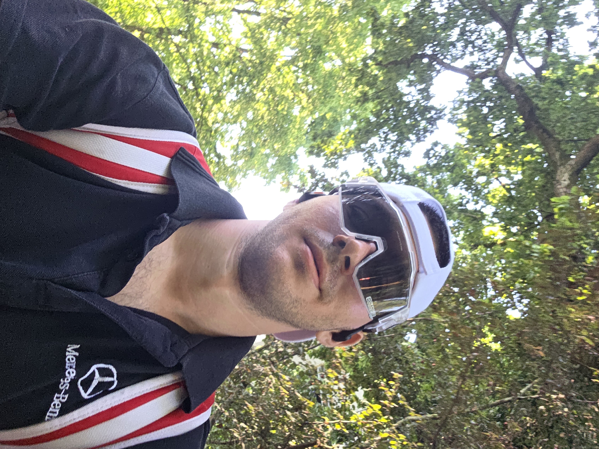 Selfies and scenery along a sunny park walkway