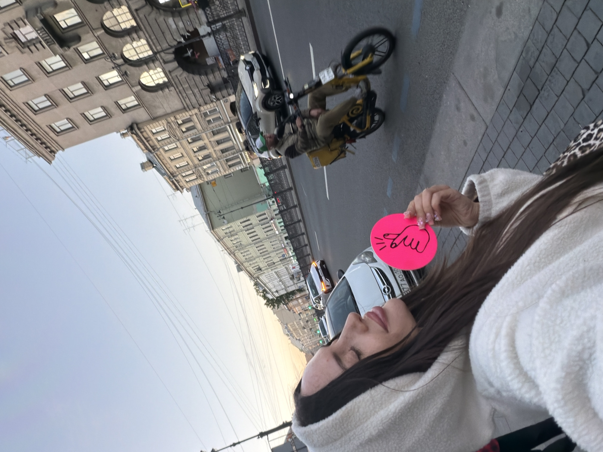 Woman takes selfie on Saint Petersburg street Friday evening