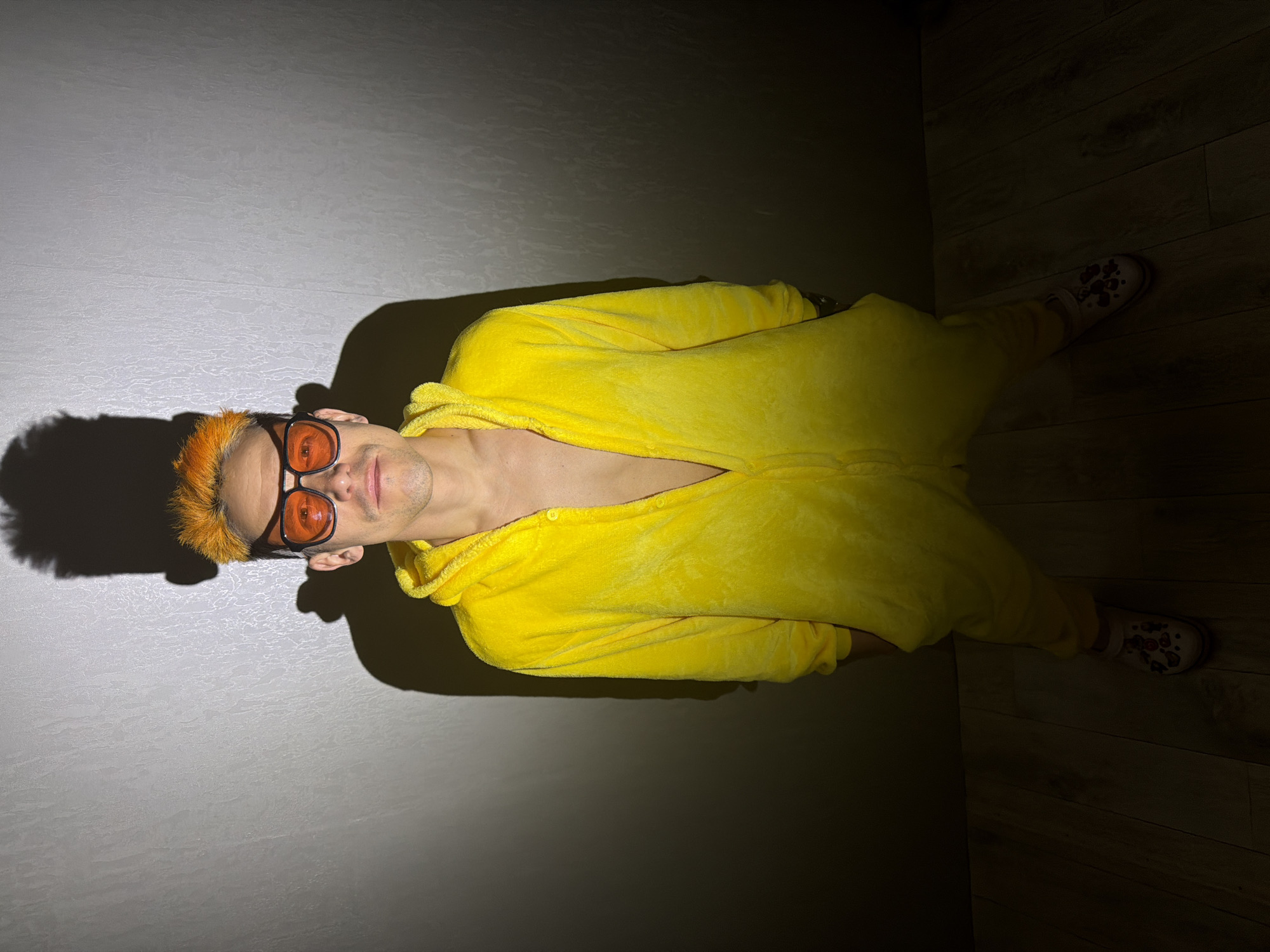 Person in yellow onesie photographed at Chaikovsky residence