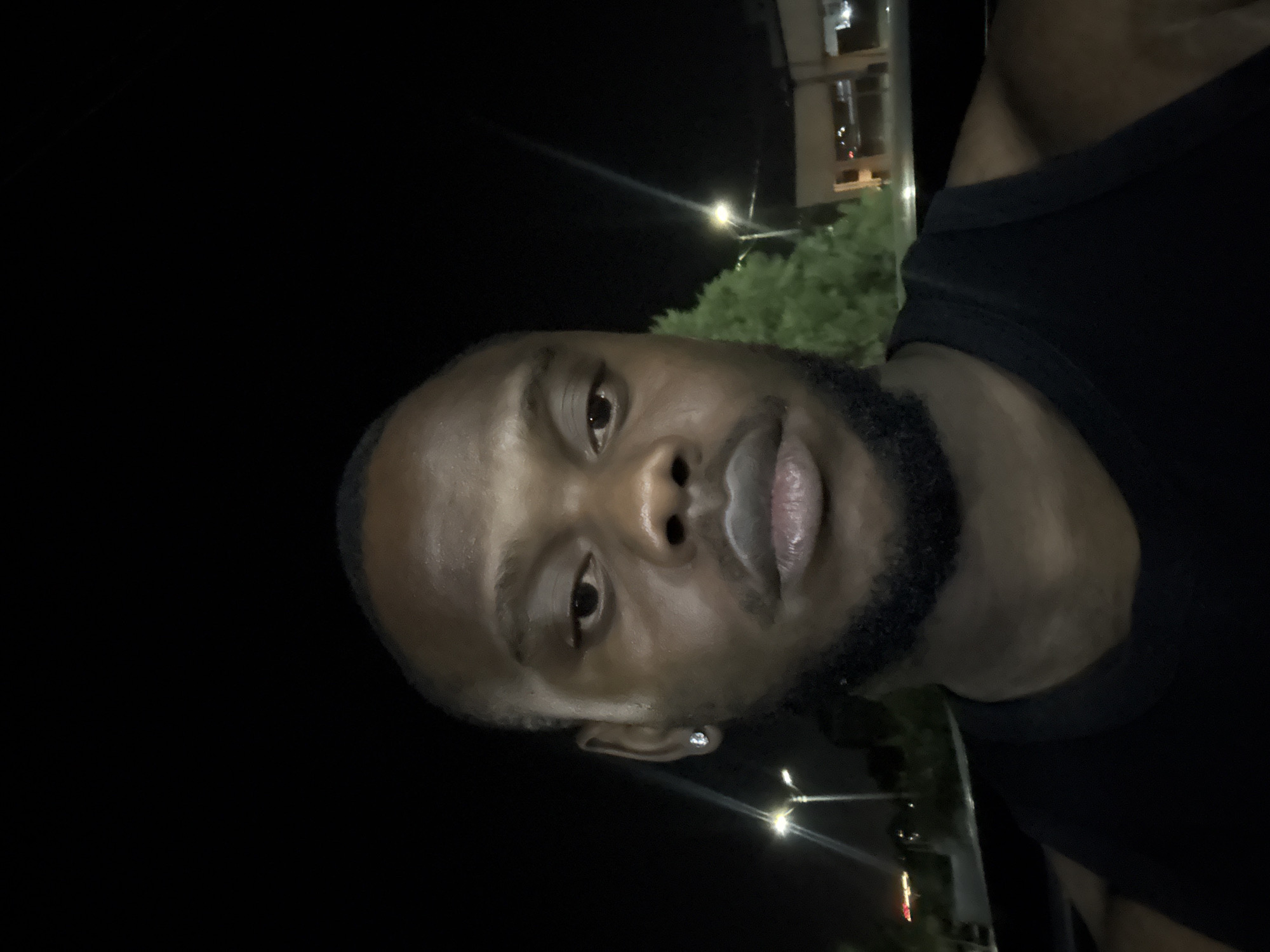 Man photographed twice in nighttime portraits in Lugbe, Nigeria