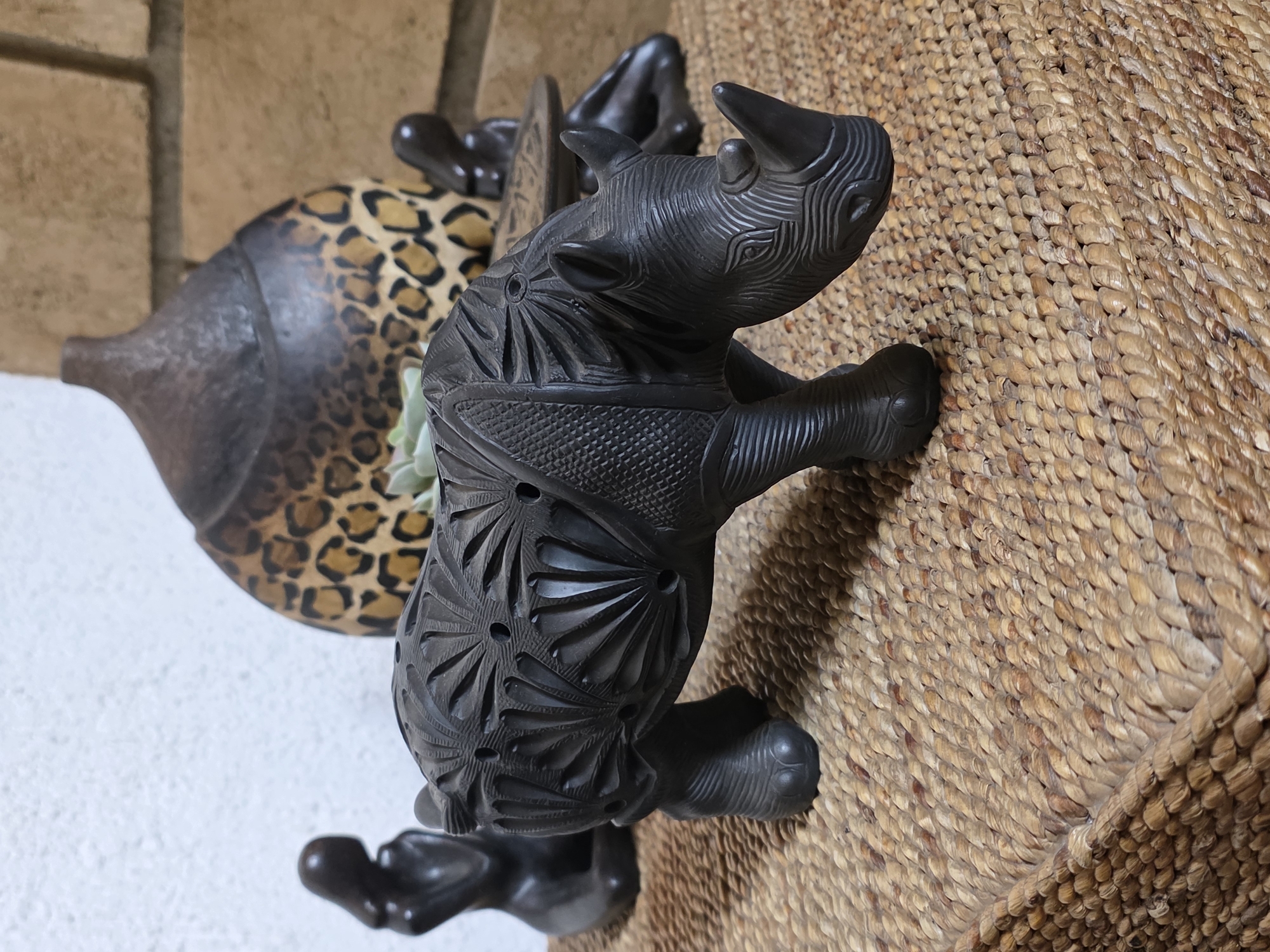 Carved wooden rhinoceros figurine observed in Cuernavaca, Mexico